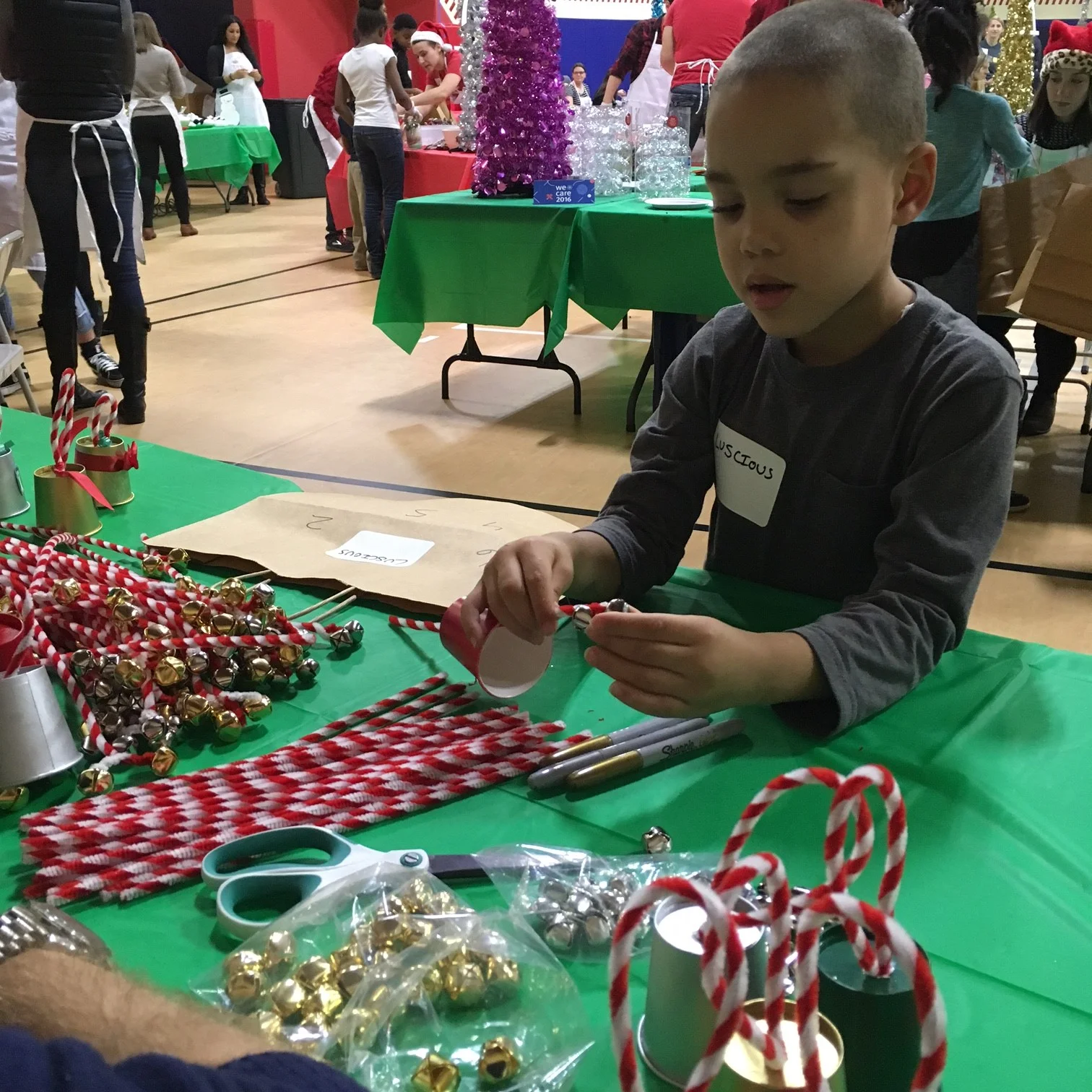 One of our early visitors learns how to assemble his bell.