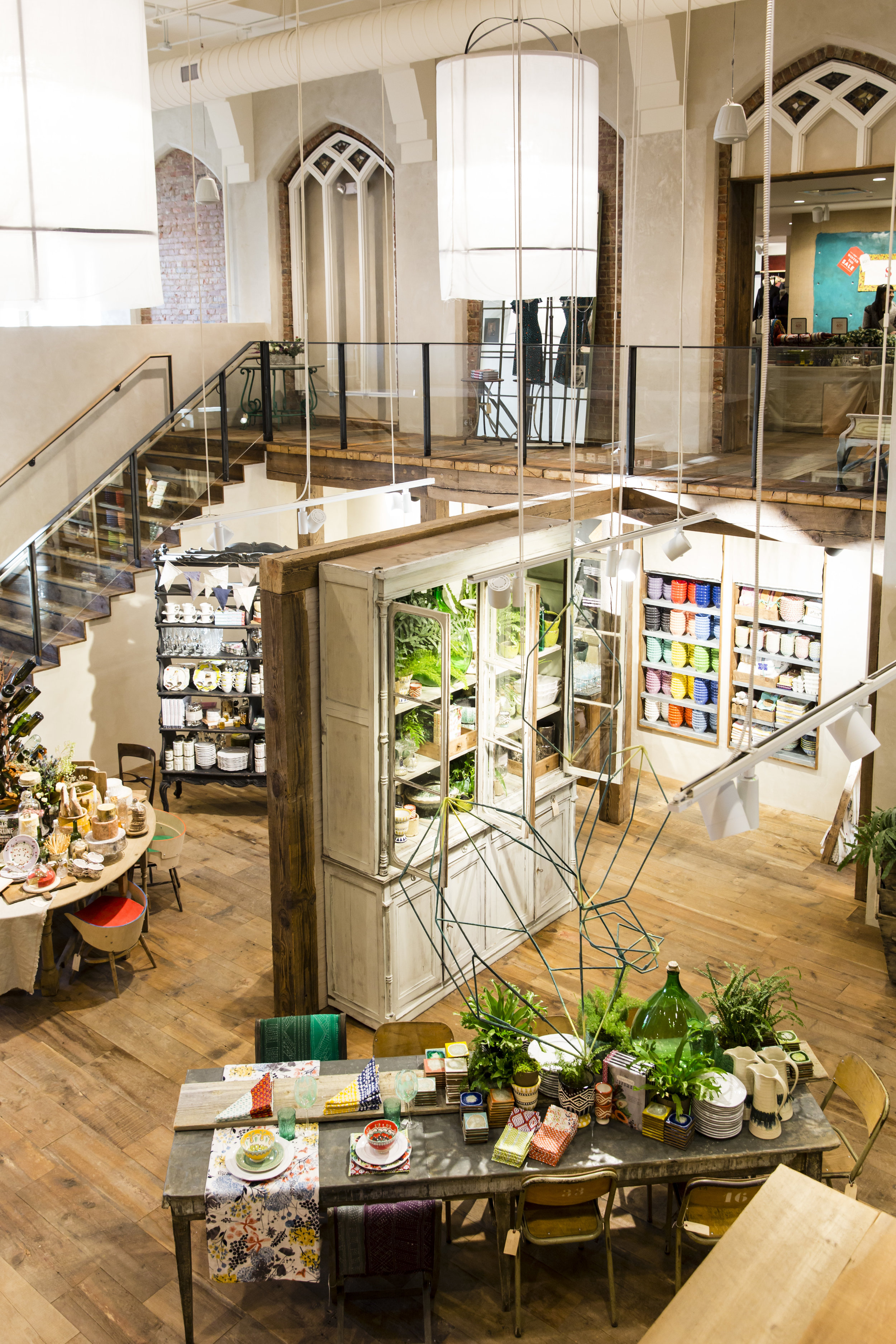 Adaptive reuse of a church preserves Gothic arches in the Anthropologie store in Toronto, created in collaboration with NewStudio Collaboration 