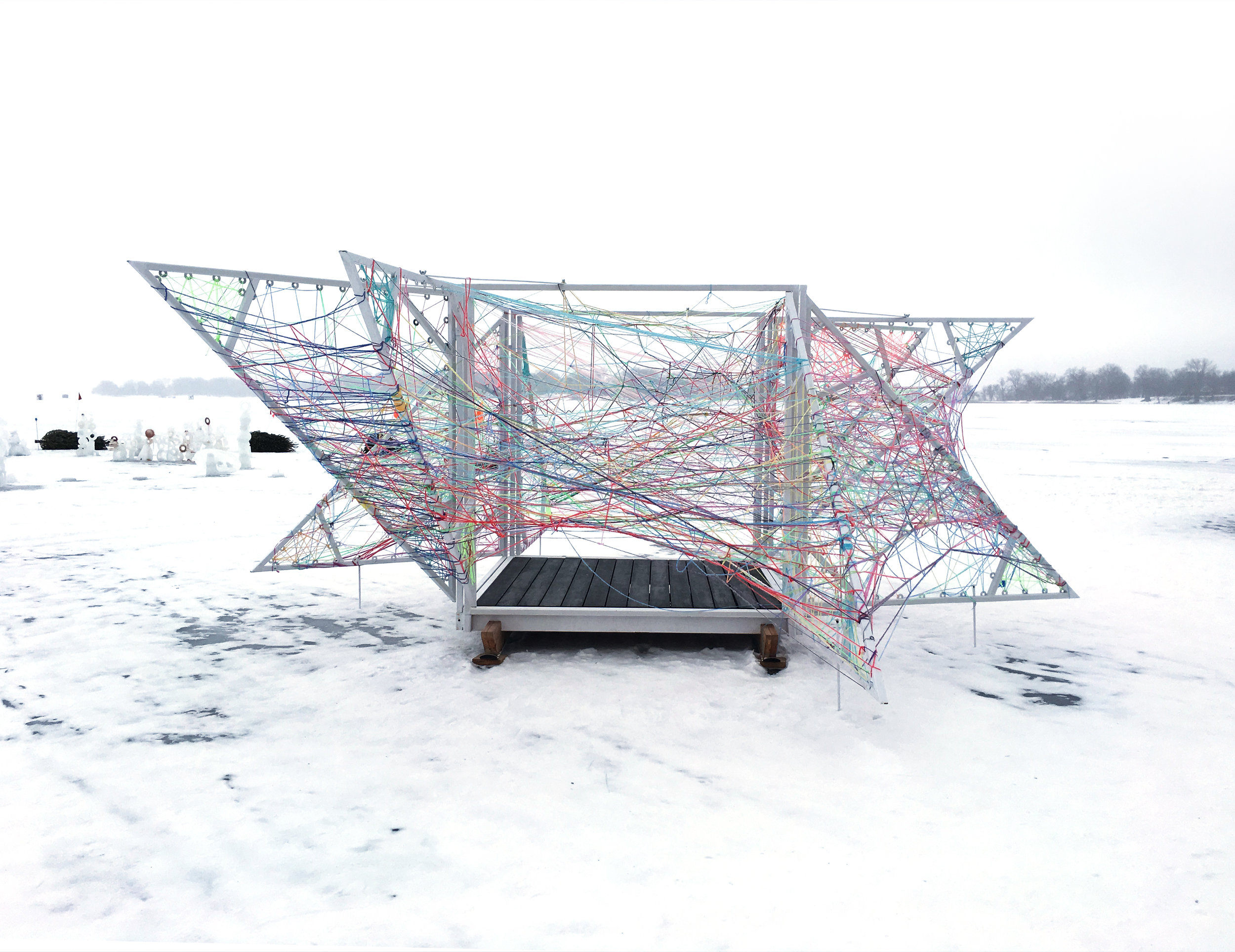 NewStudio Architecture designed the String Box Shanty to encourage visitors to thread string on the white-painted steel structure 