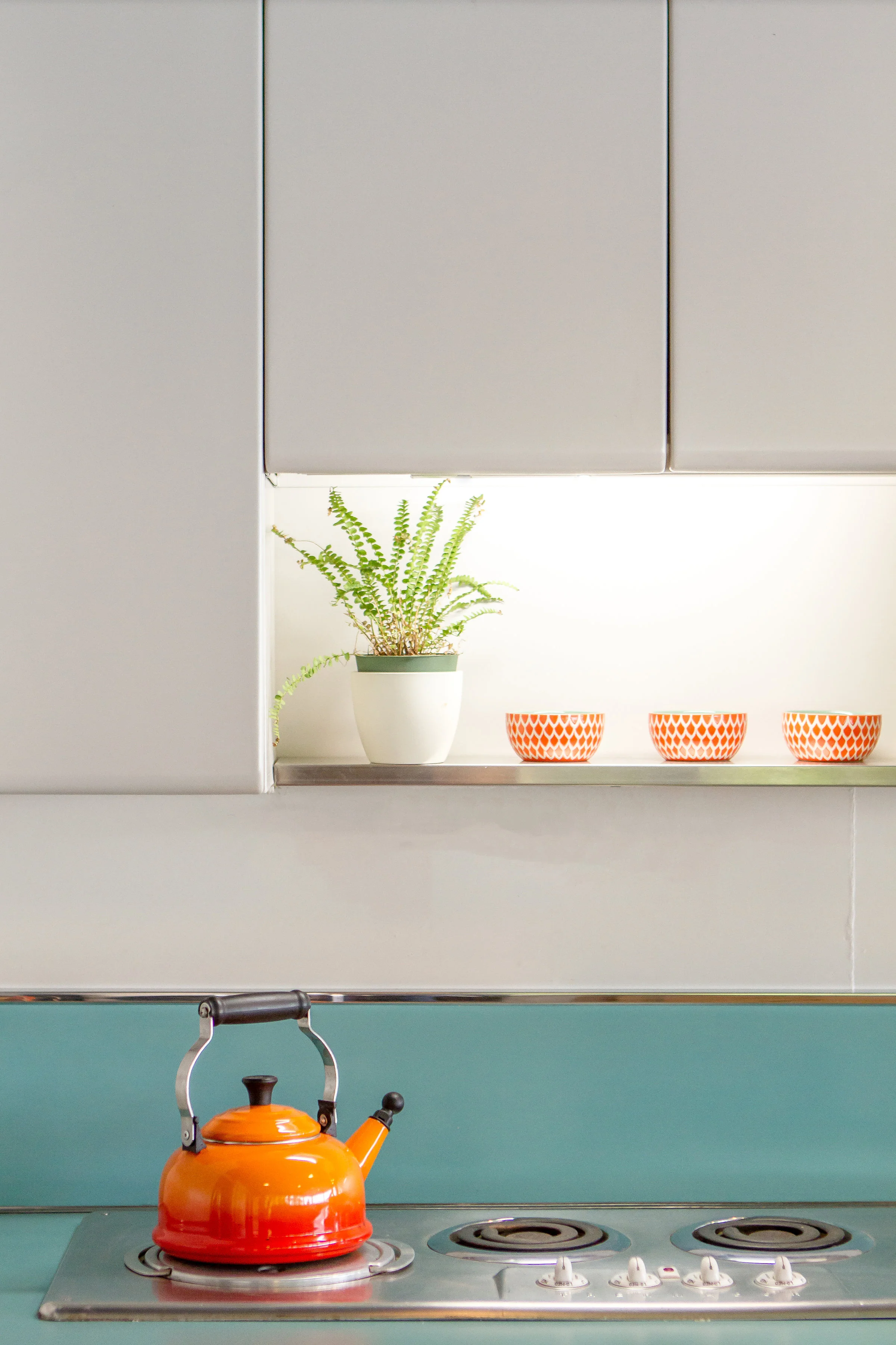 Aqua and orange accents in mid-century modern boathouse designed by NewStudio Architecture