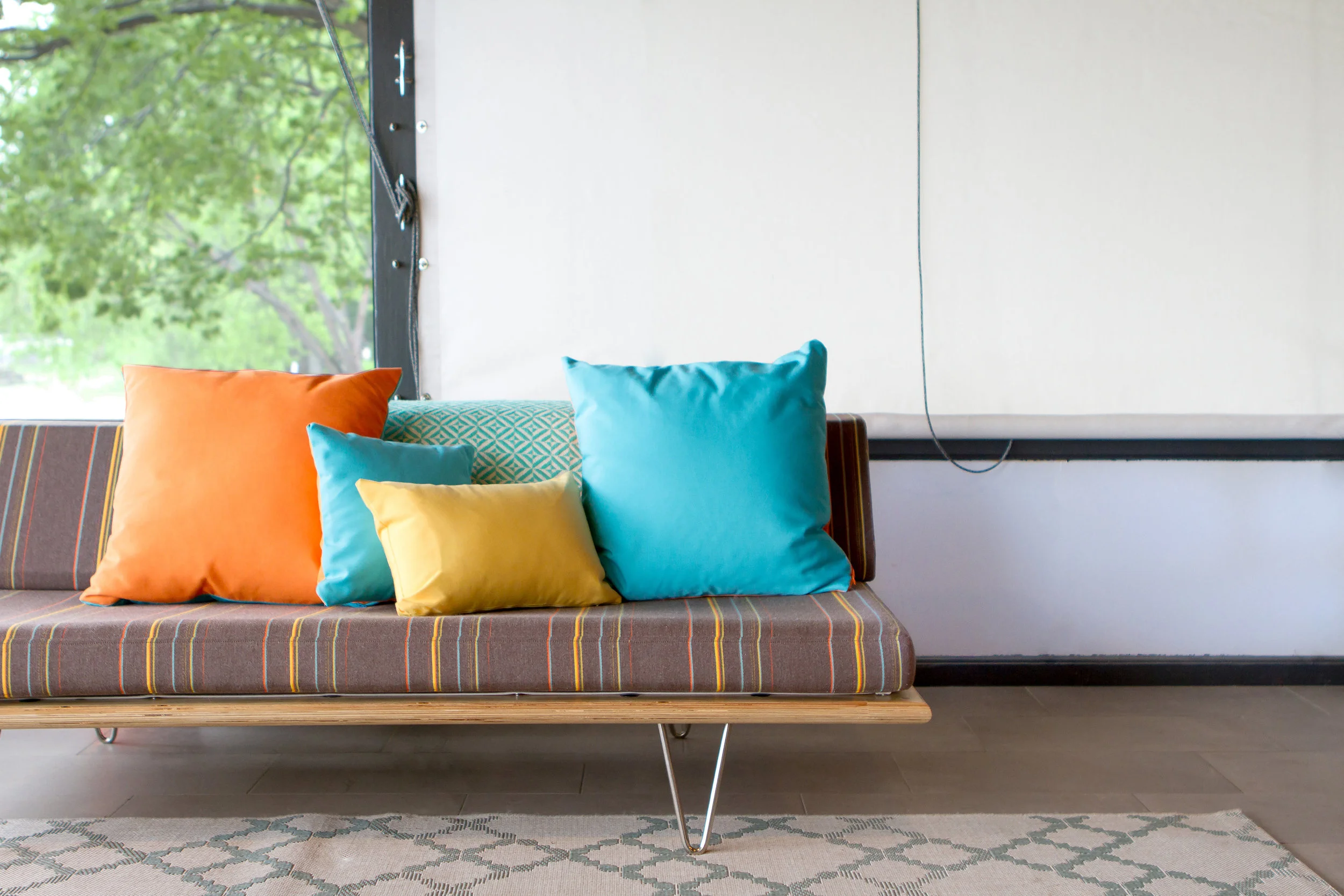 Interior design by NewStudio Architecture features classic mid-century modern colors