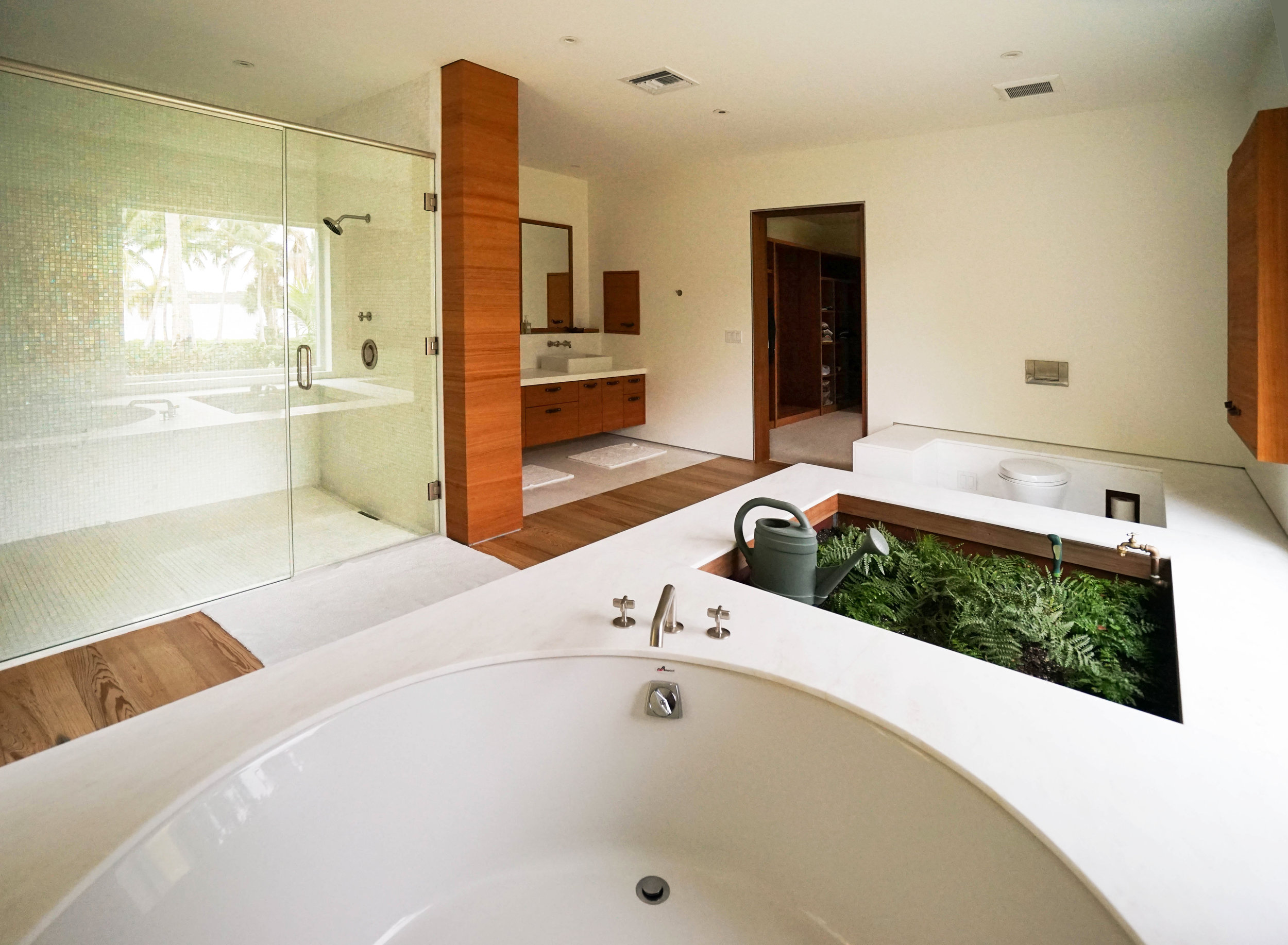 Gardener's sink incorporated into bathroom interior design by NewStudio Architecture