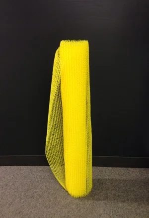 NewStudio Architecture used a polymer-based drainage mat to create a dress for the IIDA Fusion + Fashion fundraiser