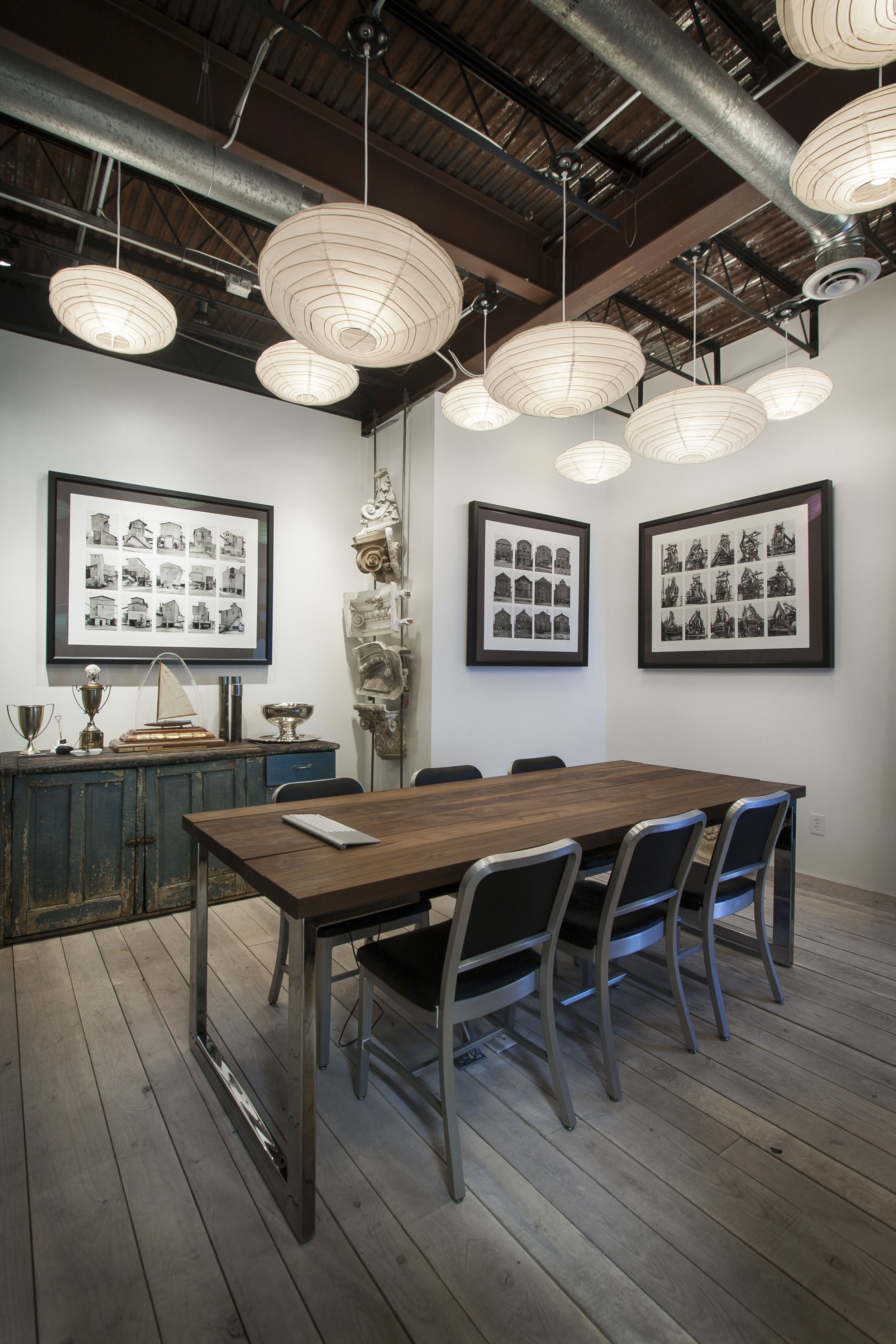 Repurposed cabinet and reclaimed wood highlights the meeting space at NewStudio Architecture's original office