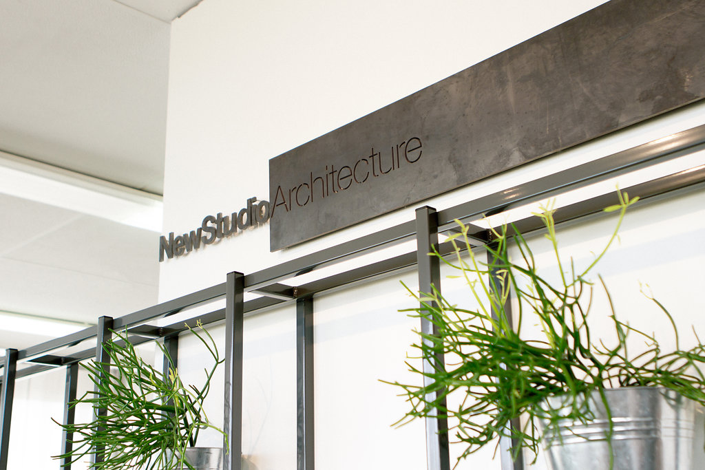 Live plant wall interior design by NewStudio Architecture for its former White Bear Lake office