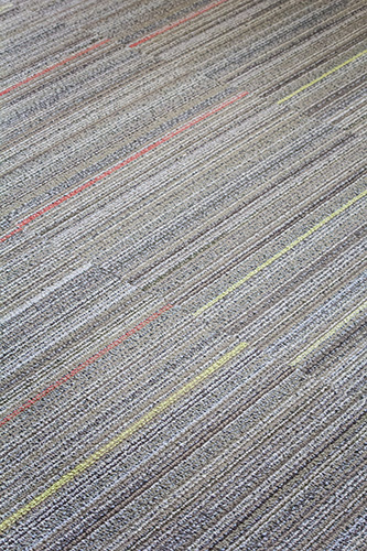 NewStudio Architecture chose colored-striped carpet panels for Johnson Turner Legal offices