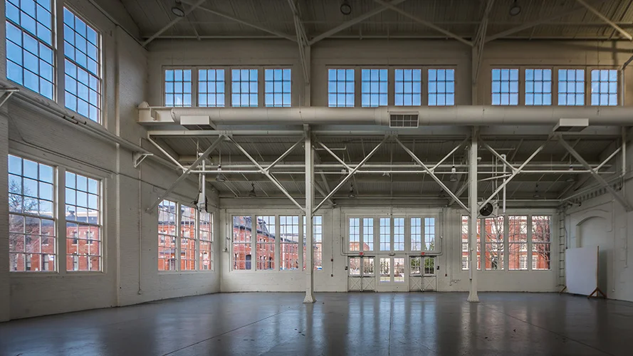 Philadelphia Navy Yard, Building 3, features multi-panel windows on two levels for this well-lit interior; designed in collaboration with NewStudio Architecture