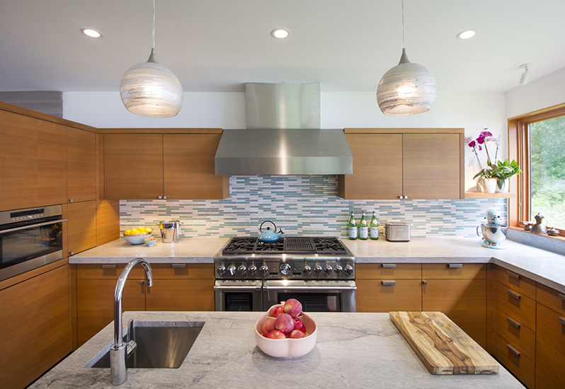 Center island in sleek mid-century modern kitchen designed by NewStudio Architecture