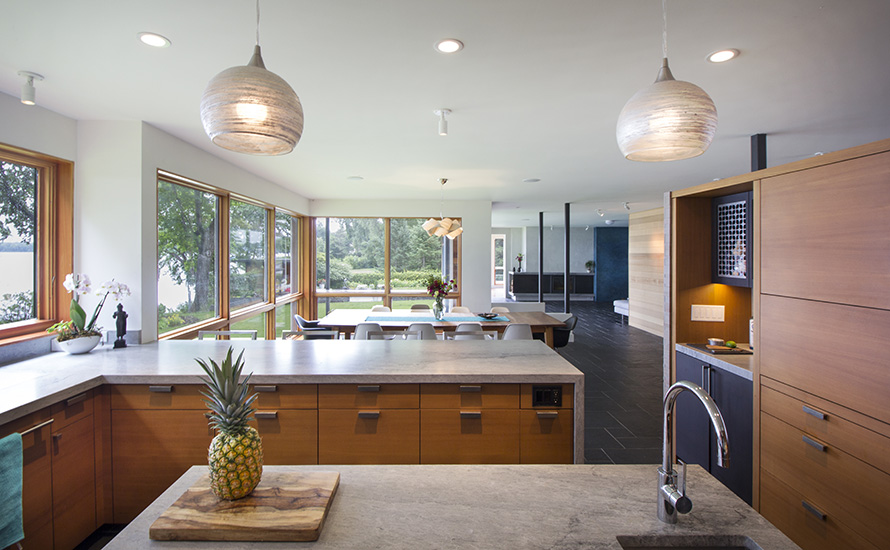 Natural light floods the kitchen and dining area, designed by NewStudio Architecture