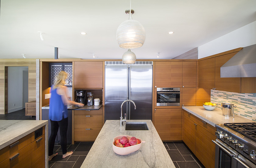 Cabinets keep coffee maker and other gear hidden when not in use; designed by NewStudio Architecture