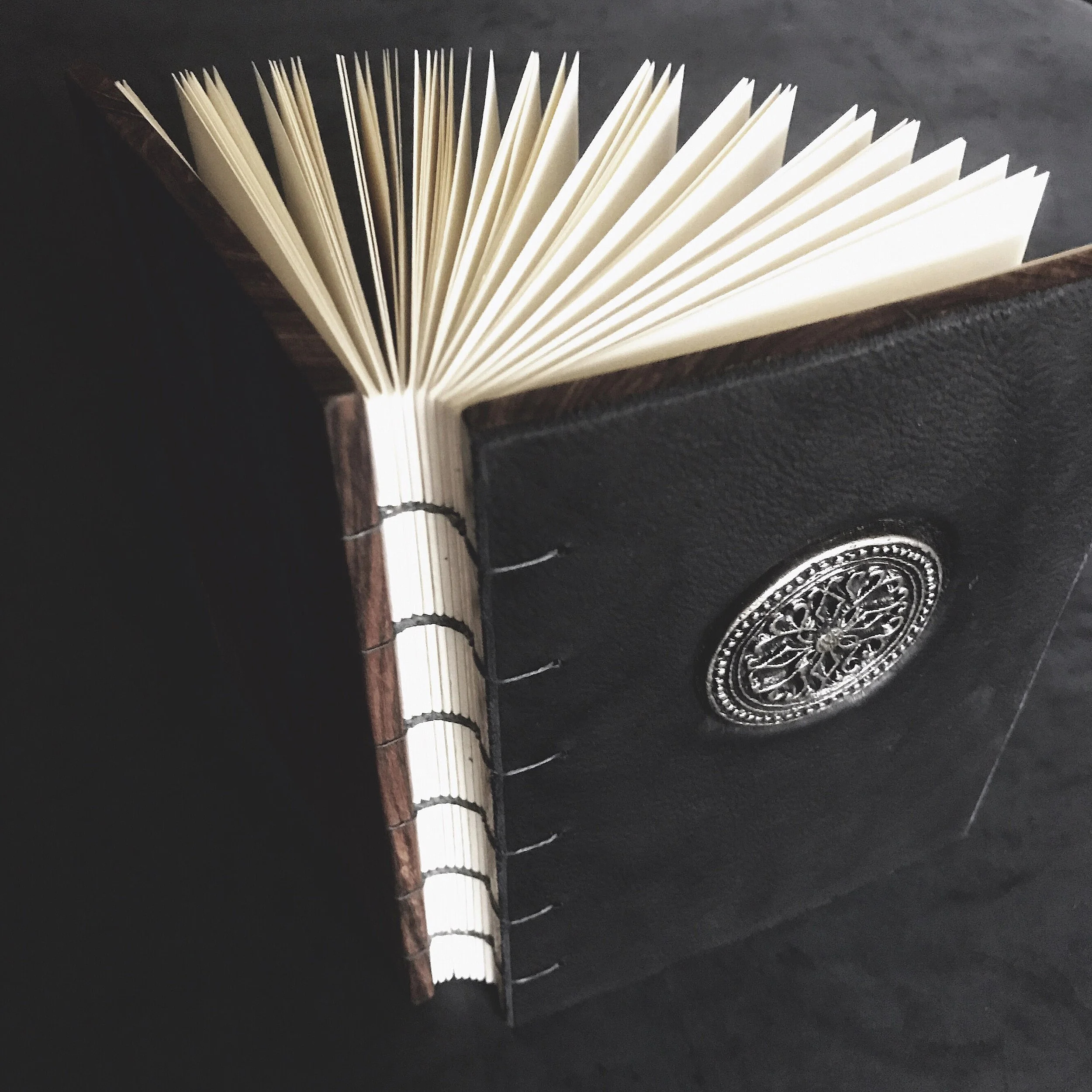 rosewood, veg tan, metal pendant