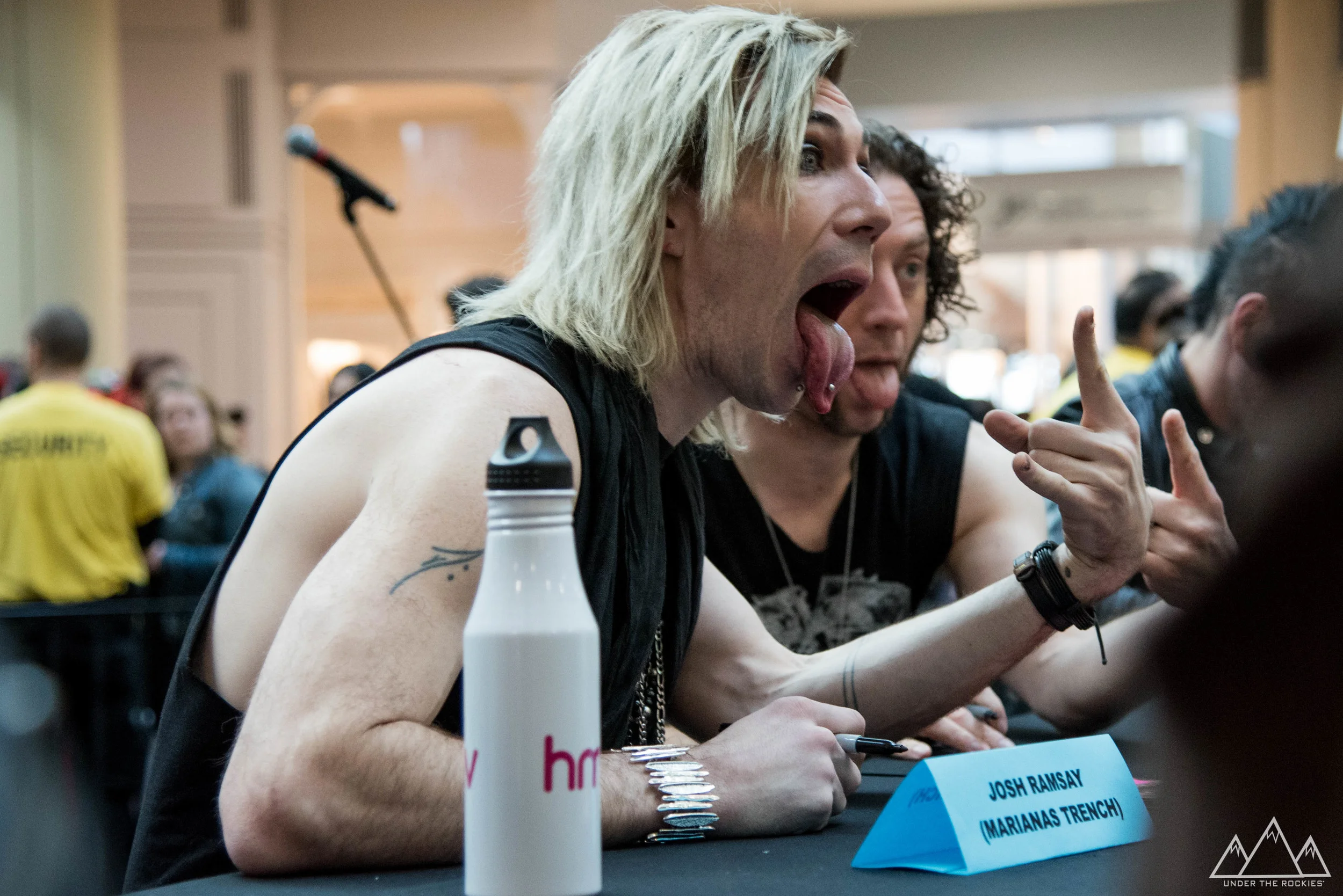 Marianas Trench posing for selfies with their fans.