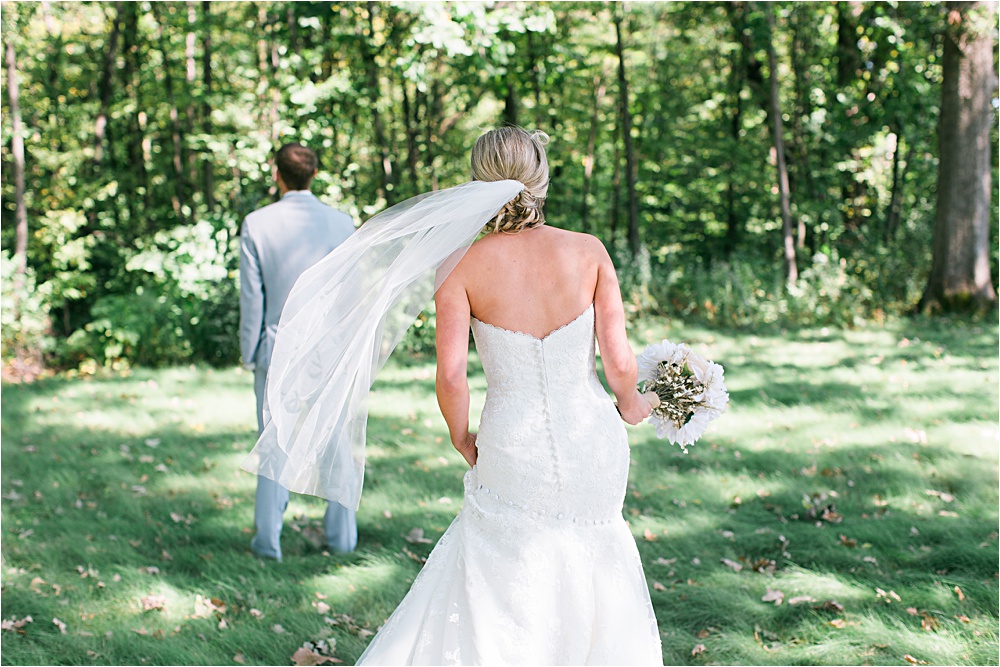 First look outside at Minnesota summer wedding in Buffalo MN photographed by Mallory Kiesow, Minnesota wedding photographer