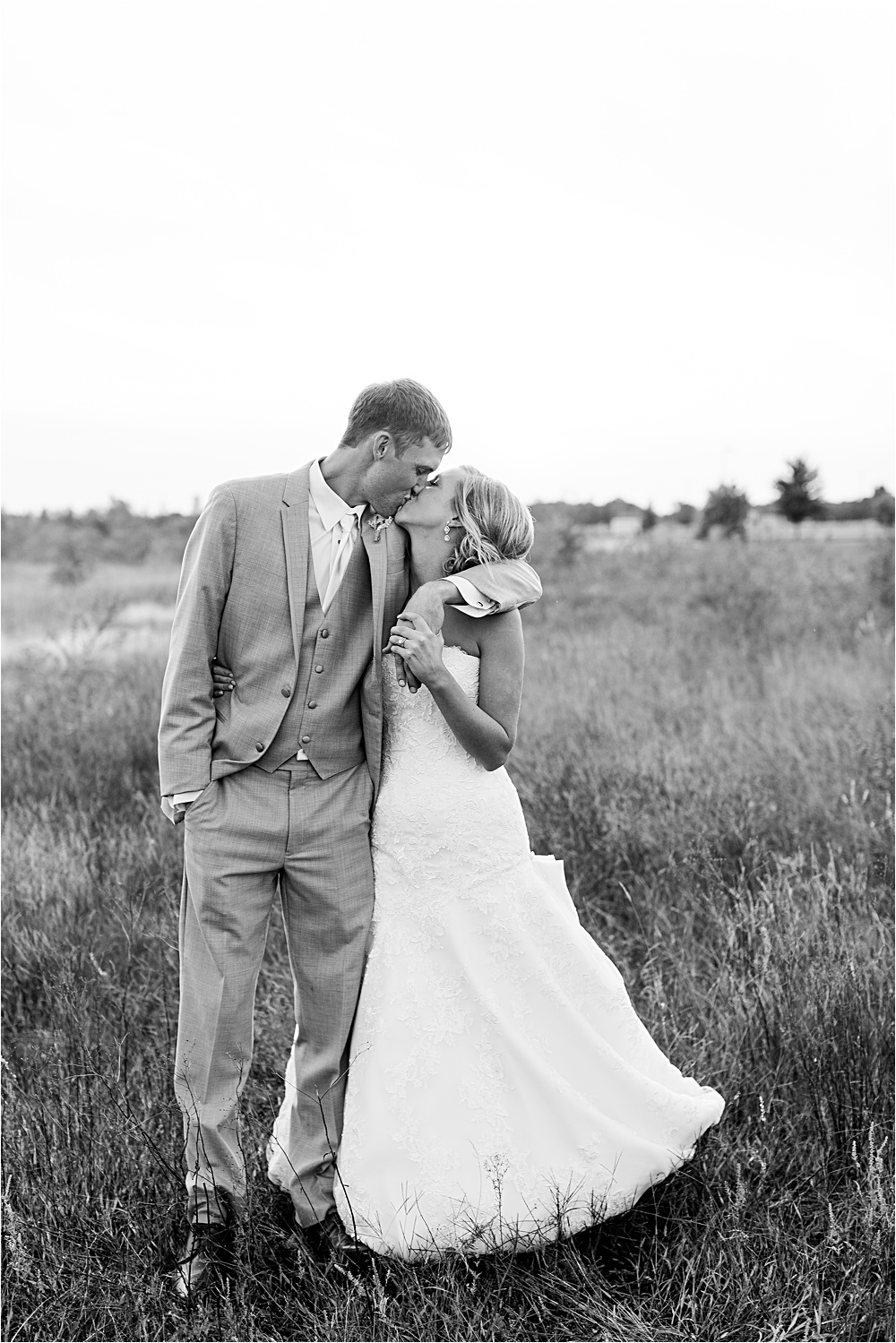 Bride and groom sunset portrait outside in field at Minnesota summer wedding in Buffalo MN photographed by Mallory Kiesow, Minnesota wedding photographer