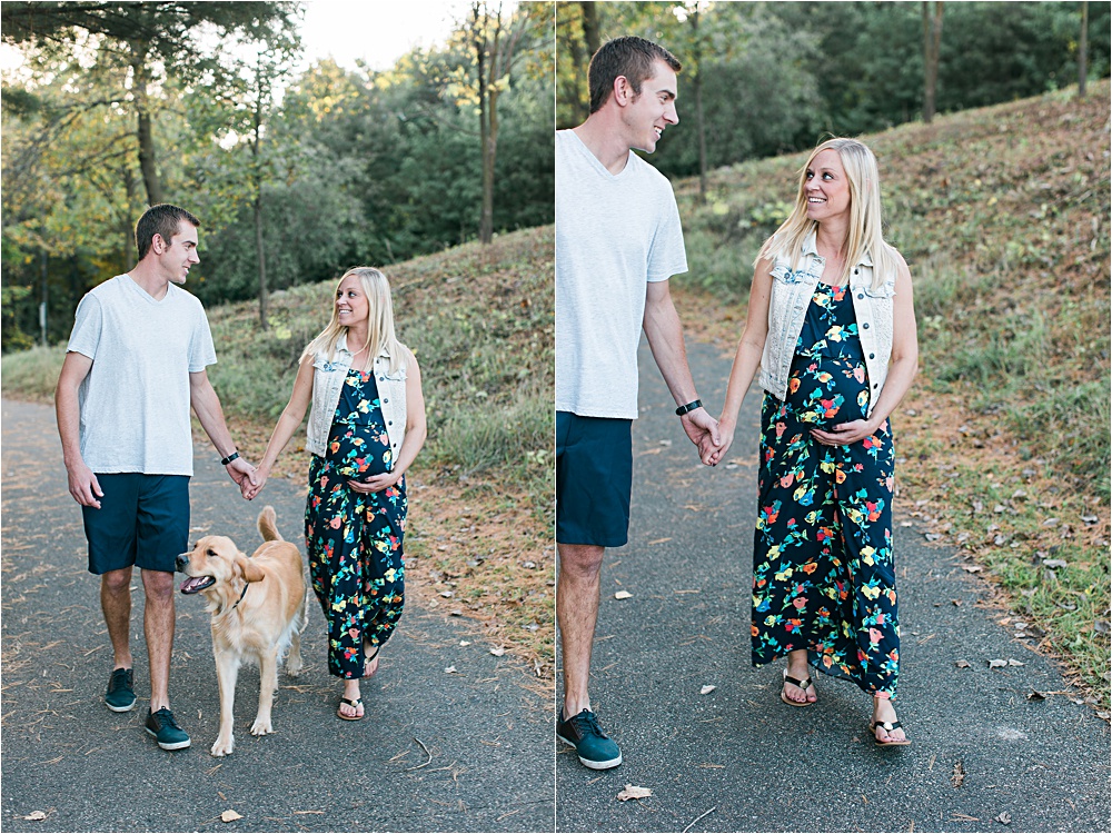 Couple and dog walking for Minnesota fall maternity photos