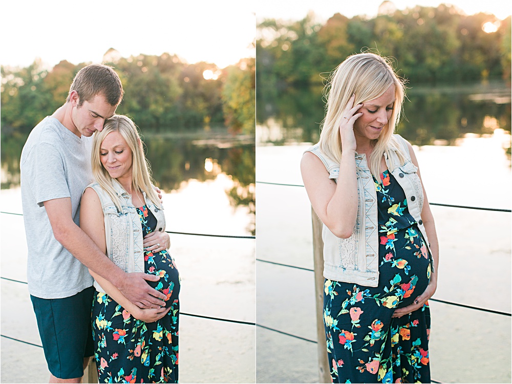 Husband and wife on bridge for fall Minnesota maternity photos showing bump with floral maxi dress and denim vest