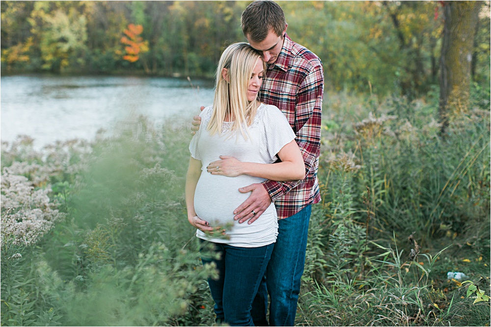 Husband and wife in fall maternity session in plaid and white in Minnesota