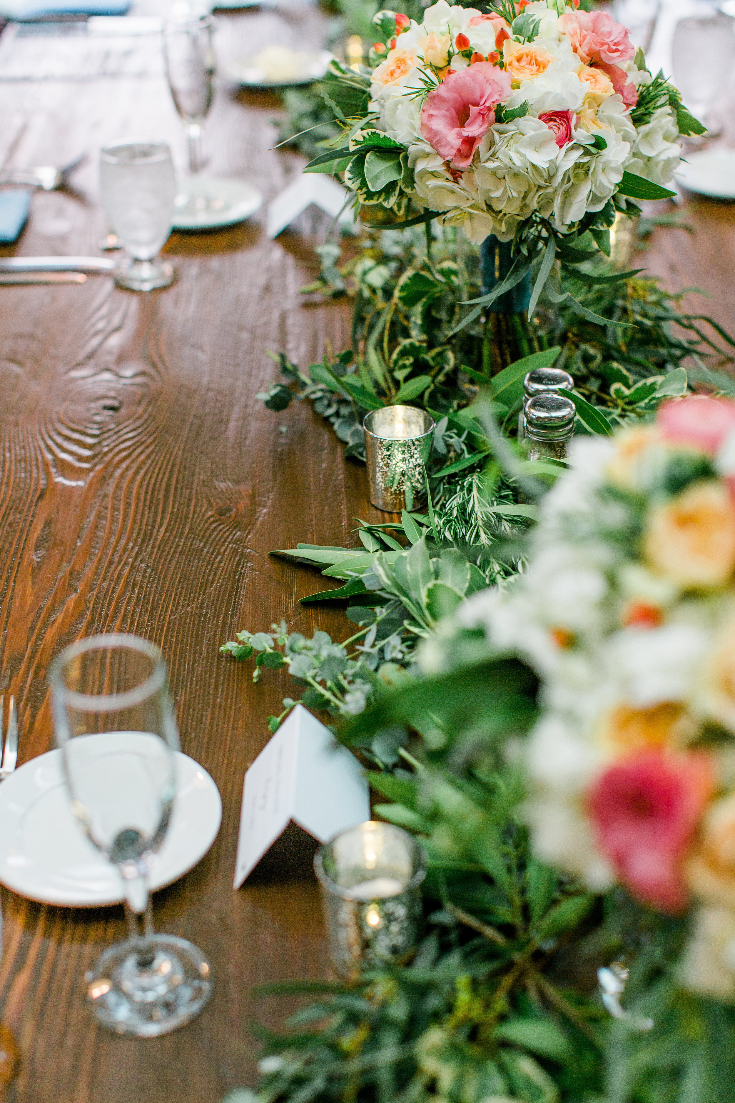 Rustic Minneapolis wedding tablescape with floral garland Minnesota wedding photography Mallory Kiesow Photography