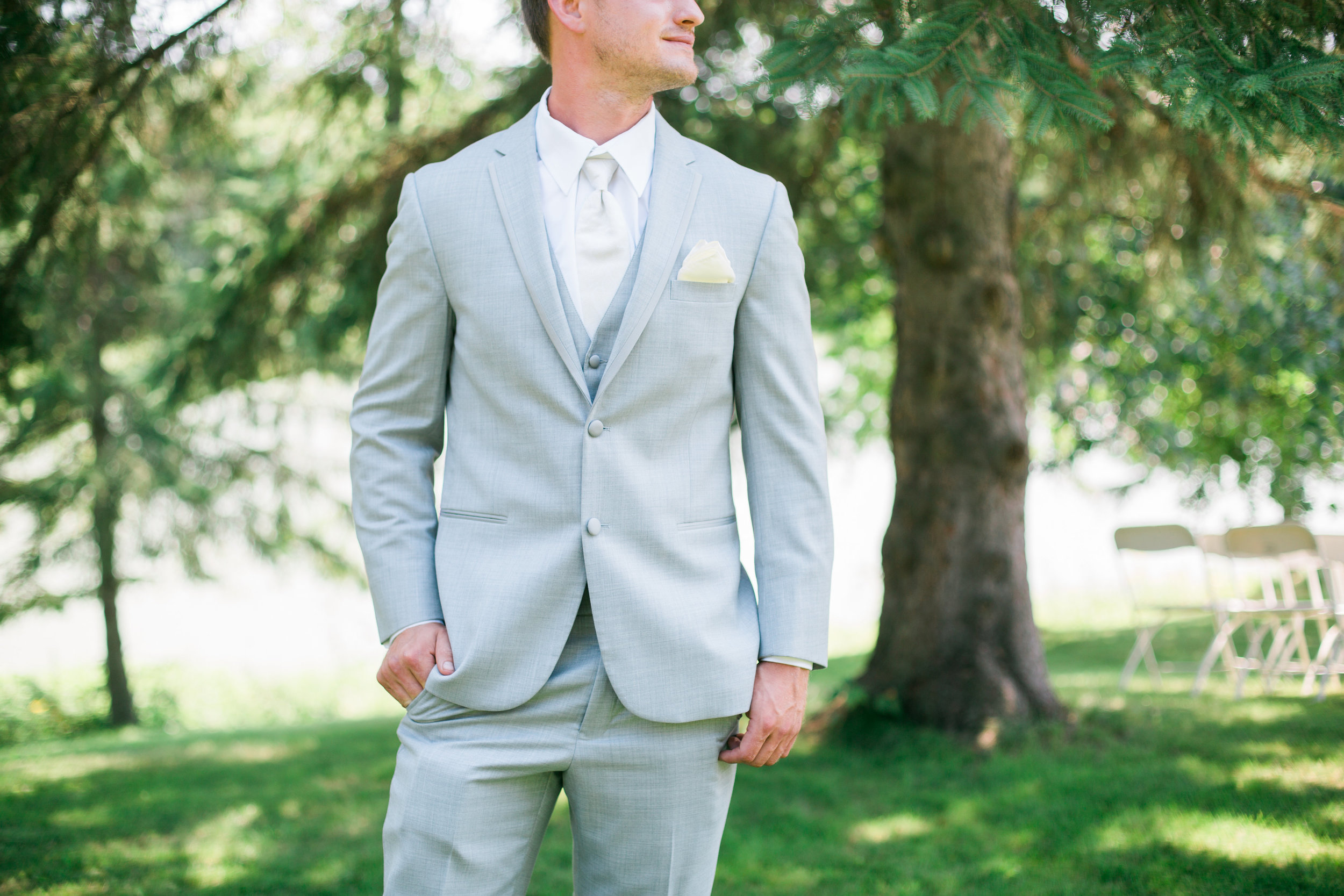 Groom attire of grey suit at rural Minnesota wedding Minnesota wedding photography Mallory Kiesow Photography