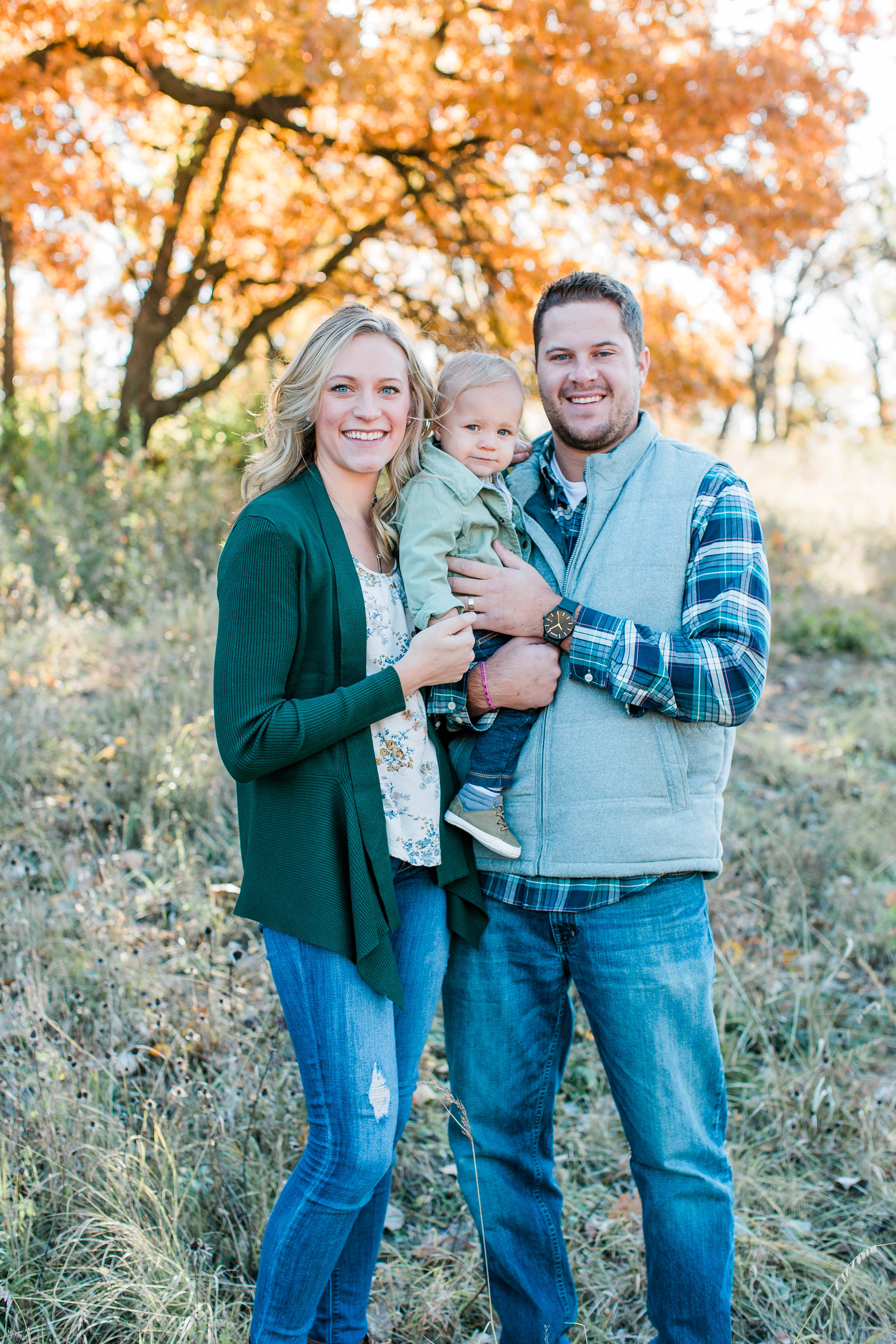 Family with husband wife and baby boy family photos in fall Minnesota family photographer Mallory Kiesow Photography