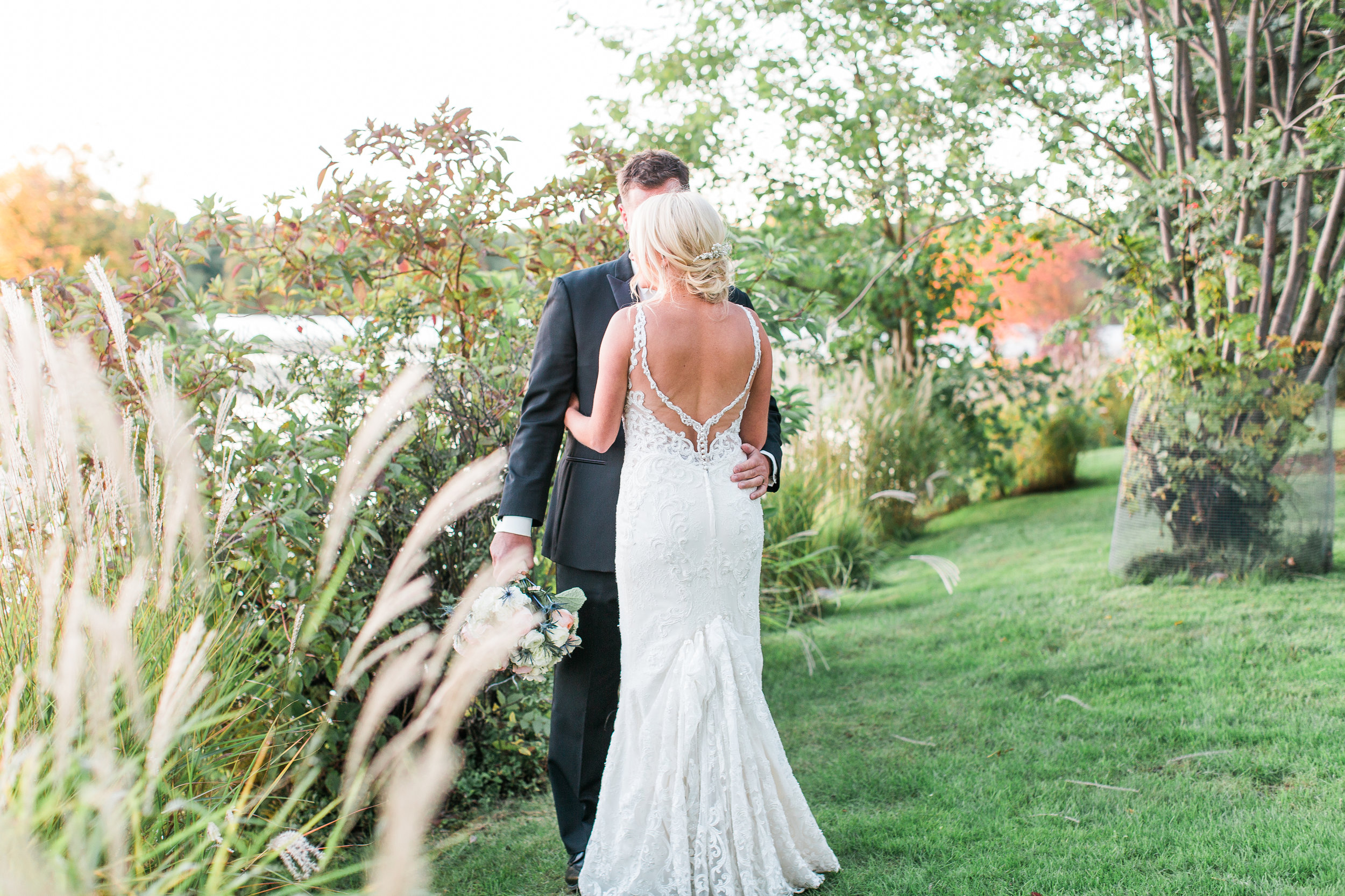 Charthouse Lakeville Minnesota wedding bride and groom at sunset back of dress detail Minnesota wedding photography Mallory Kiesow Photography