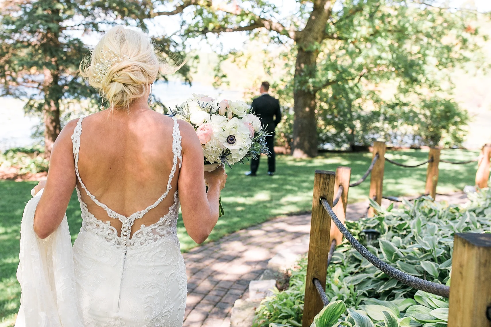 Bride first look with groom for wedding at the Chart House Summer Wedding Lakeville Minnesota Minneapolis Wedding Photographer Mallory Kiesow