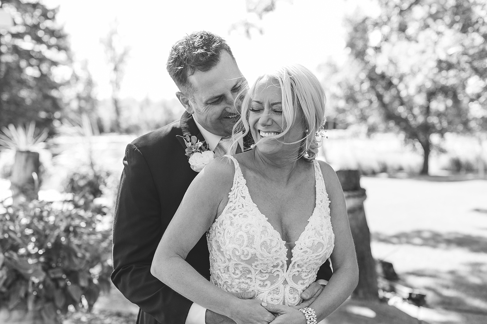 Bride and groom laughing black and white on wedding day at the Chart House Summer Wedding Lakeville Minnesota Minneapolis Wedding Photographer Mallory Kiesow