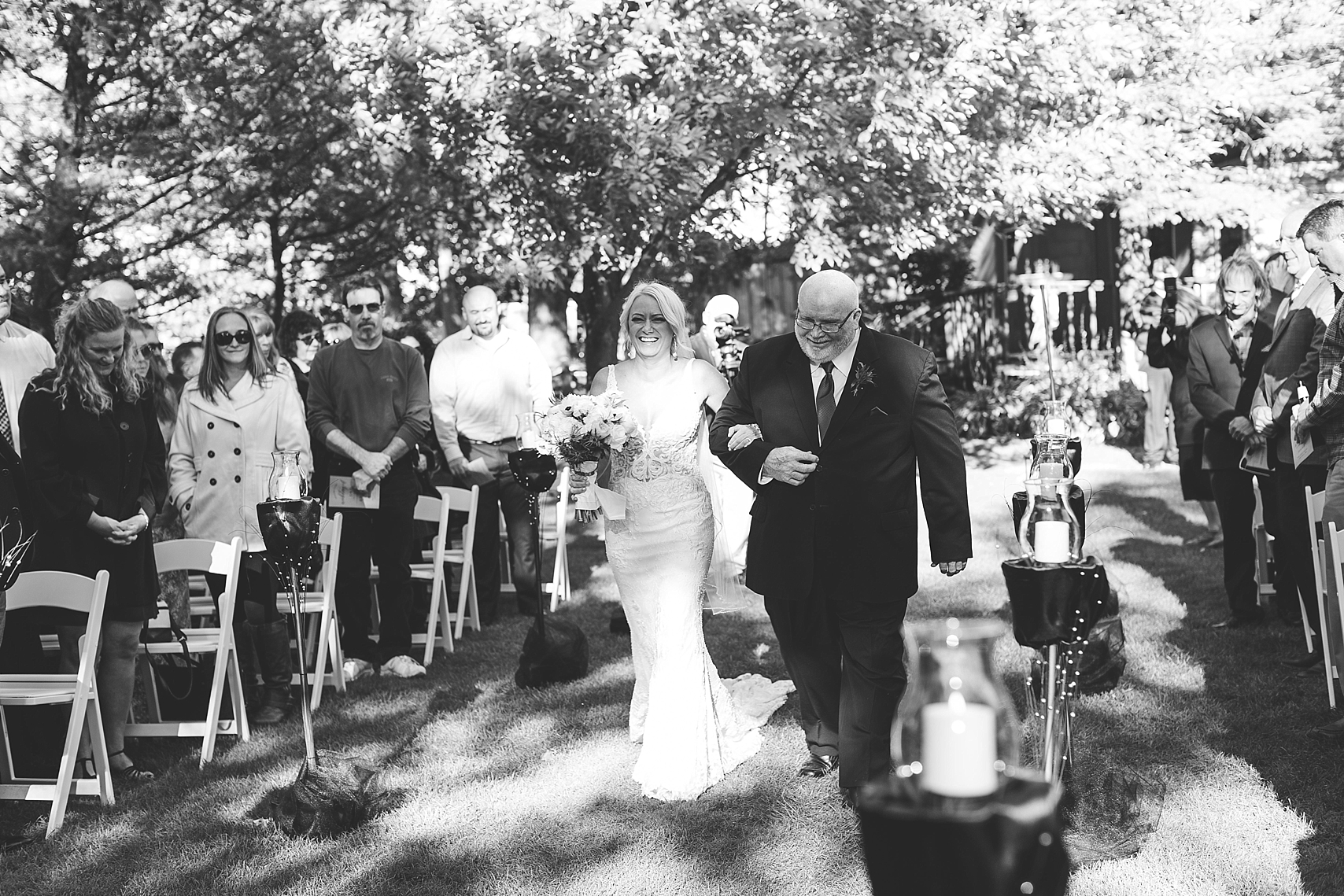 Outdoor wedding ceremony bride walking down aisle at the Chart House Summer Wedding Lakeville Minnesota Minneapolis Wedding Photographer Mallory Kiesow