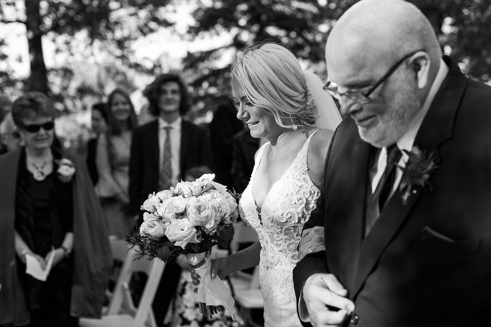 Outdoor wedding ceremony bride walking down aisle at the Chart House Summer Wedding Lakeville Minnesota Minneapolis Wedding Photographer Mallory Kiesow