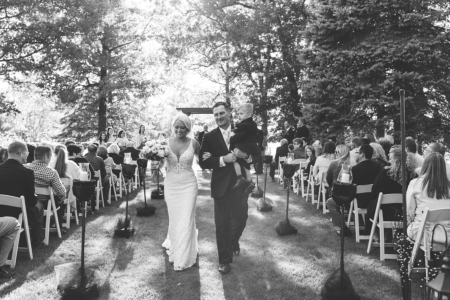 Outdoor wedding ceremony celebratory exit at the Chart House Summer Wedding Lakeville Minnesota Minneapolis Wedding Photographer Mallory Kiesow