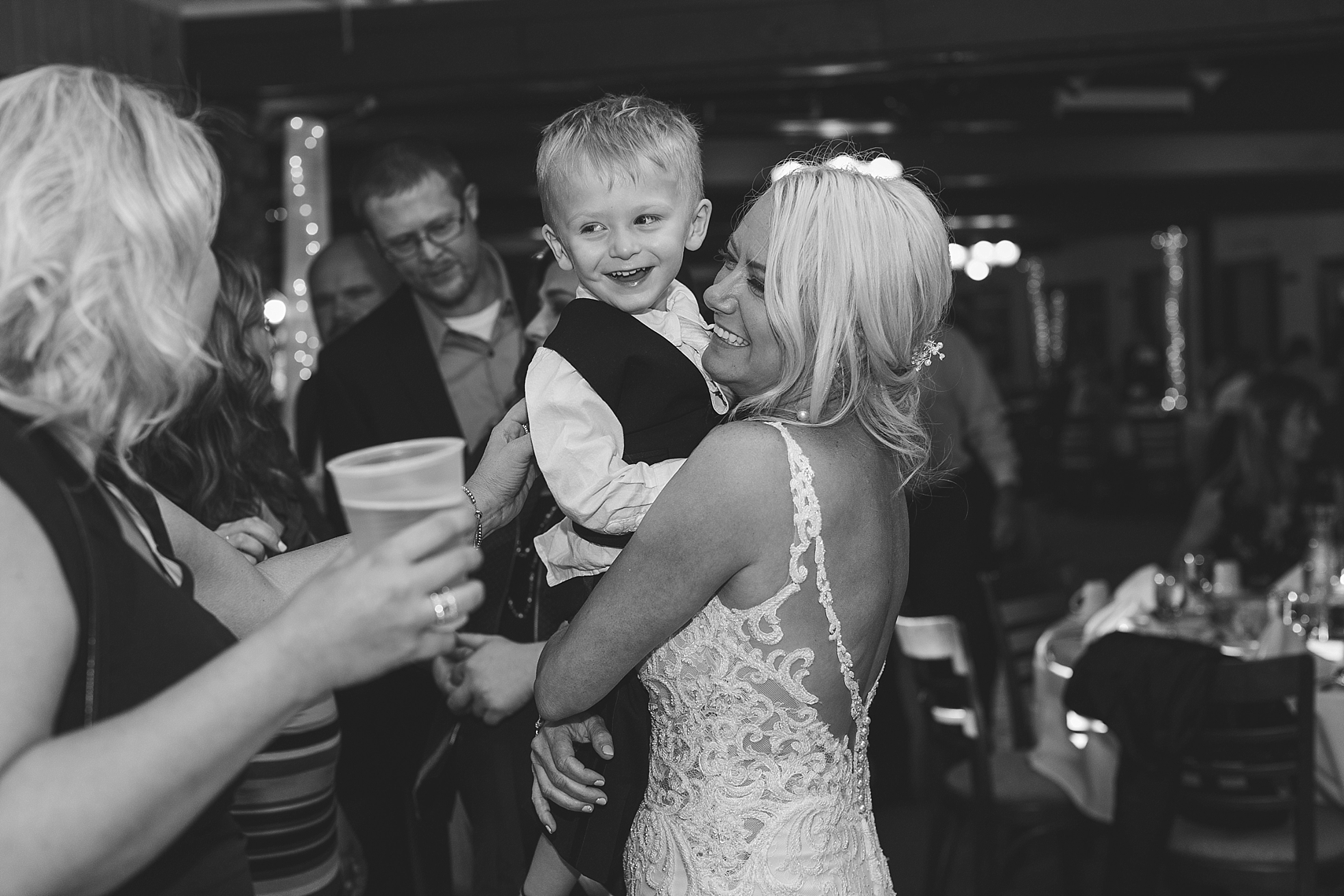 Bride and son candid at the Chart House Summer Wedding Lakeville Minnesota Minneapolis Wedding Photographer Mallory Kiesow