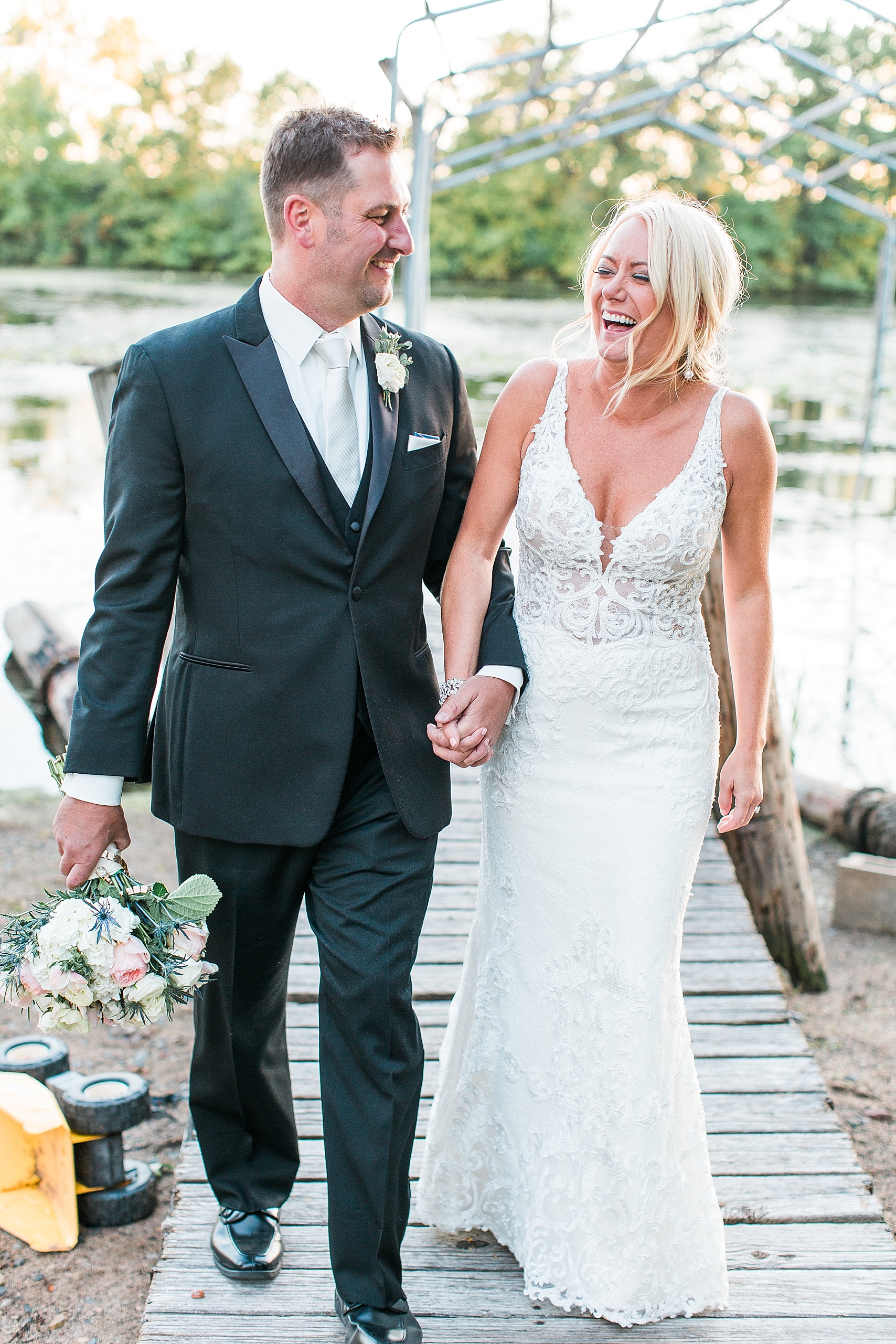 Bride and groom sunset golden hour portrait on dock at the Chart House Summer Wedding Lakeville Minnesota Minneapolis Wedding Photographer Mallory Kiesow