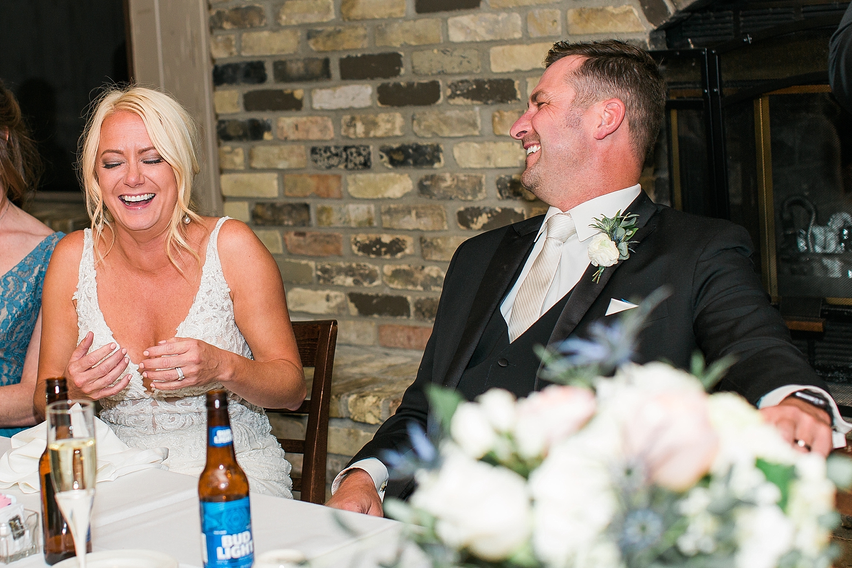 Bride and groom laughing at speech at the Chart House Summer Wedding Lakeville Minnesota Minneapolis Wedding Photographer Mallory Kiesow