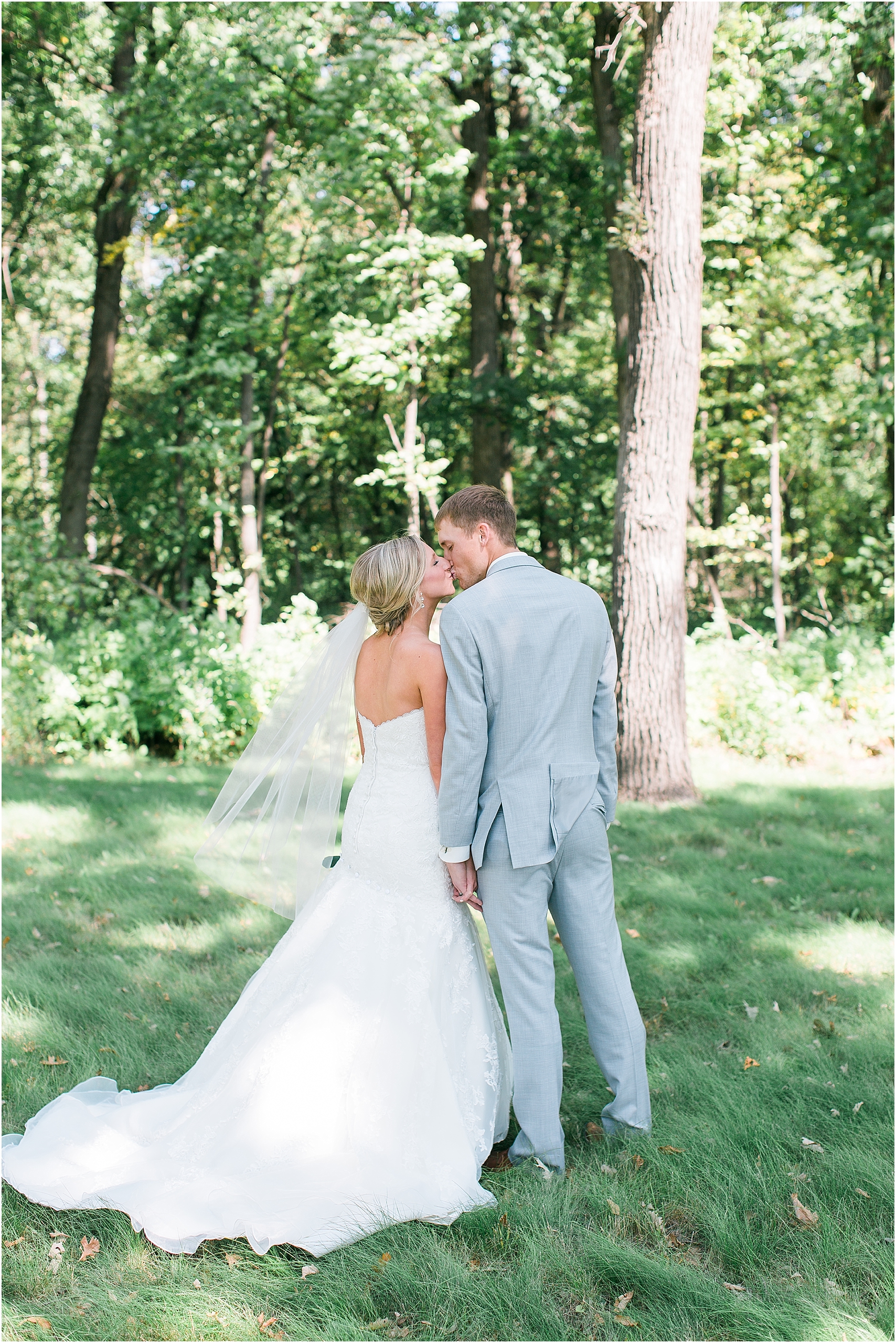 Bride and groom portrait kissing outside at Minnesota summer wedding in Buffalo MN photographed by Mallory Kiesow, Minnesota wedding photographer