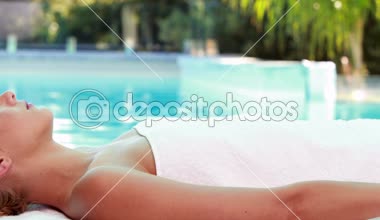 depositphotos_48879907-Peaceful-blonde-lying-on-massage-table-poolside.jpg