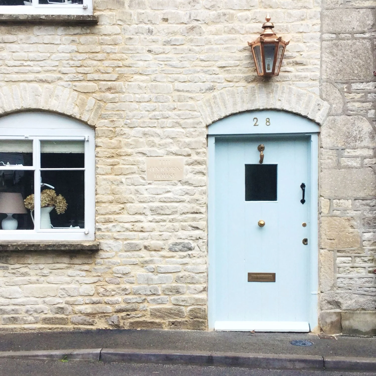 This house is called The Unicorn House! And what a lovely blue door.