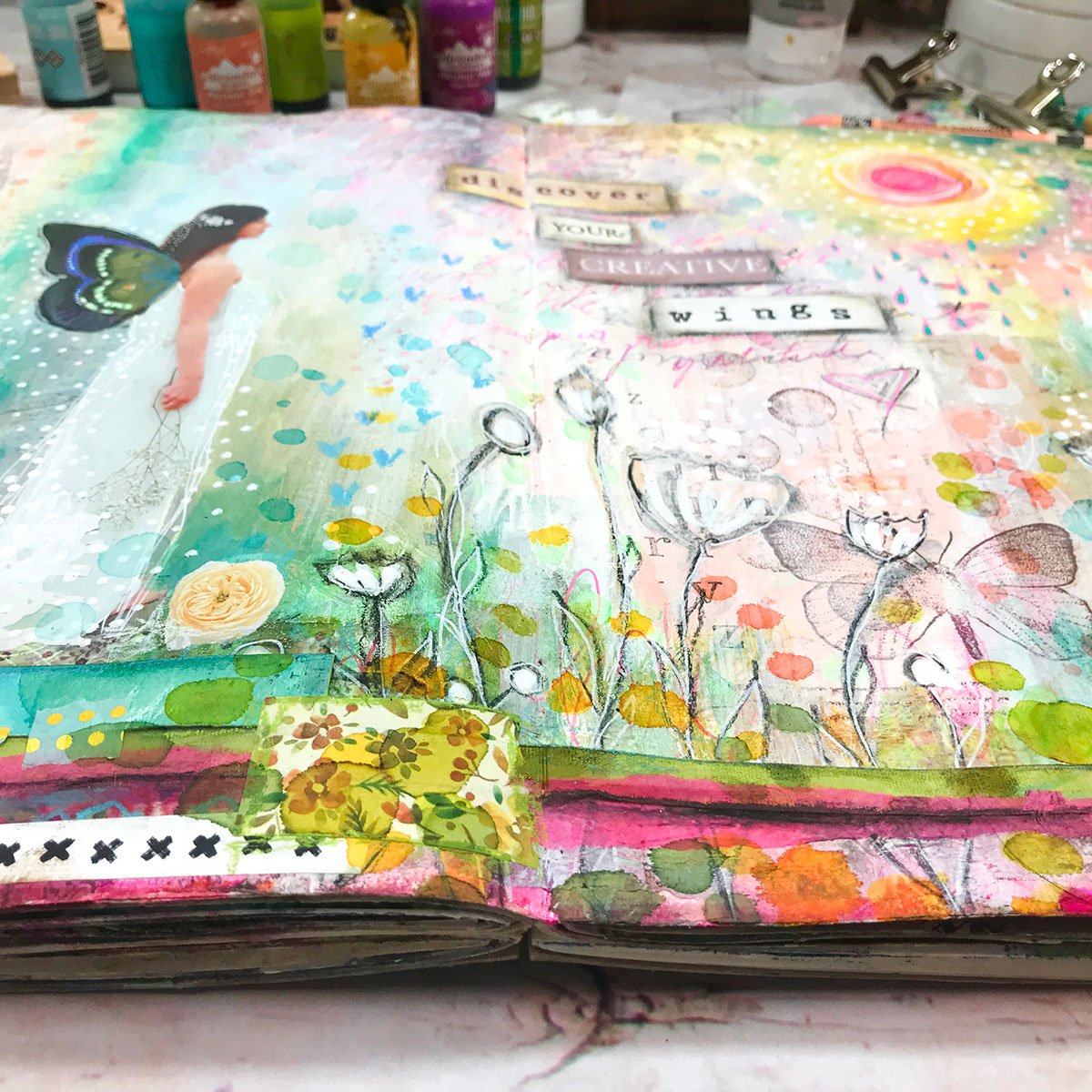 colorful mixed media art journal page with fairy