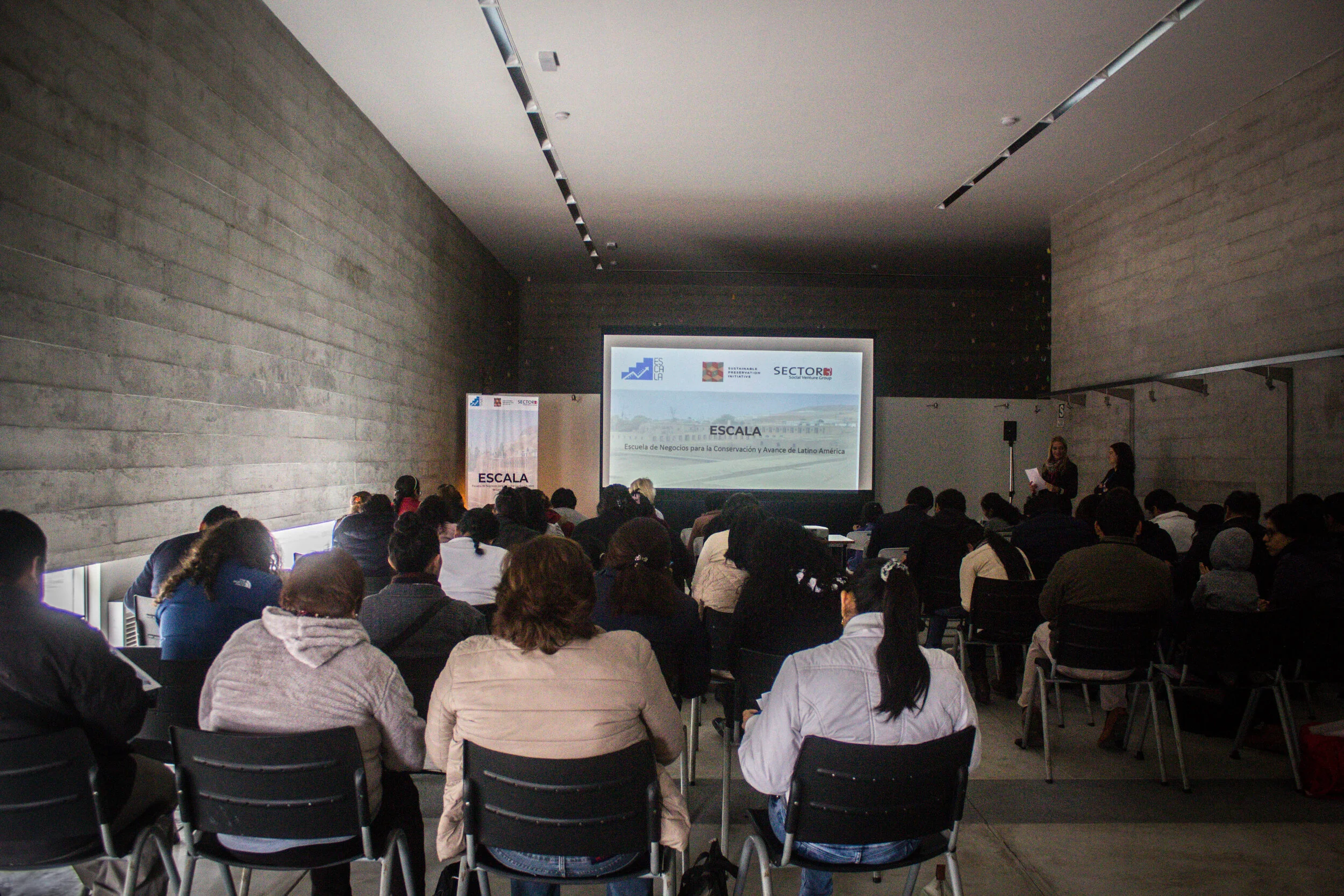 Eager participants attend the ESCALA Business School launch event near Lima, Peru.