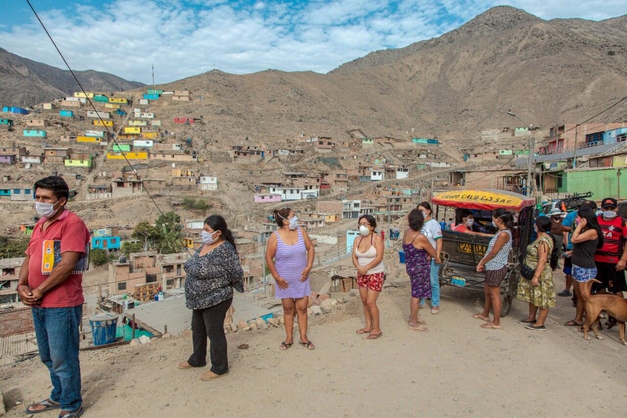 ESCALA participants delivering masks to volunteers and Lima city officials distributing supplies to remote areas near Lima.jpg