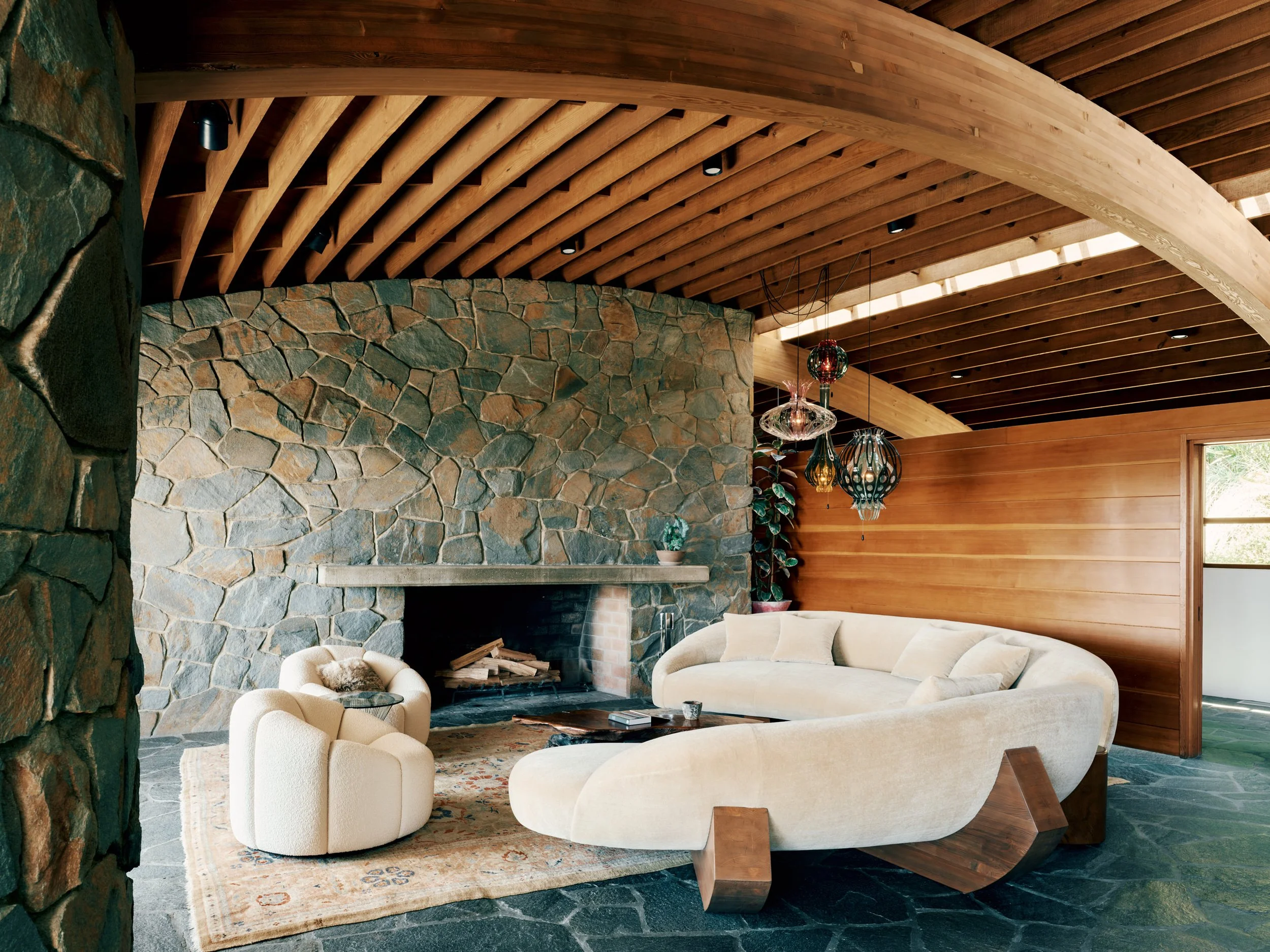 Custom Glulam Couch and Stone Fireplace – Lautner Castle Living Room