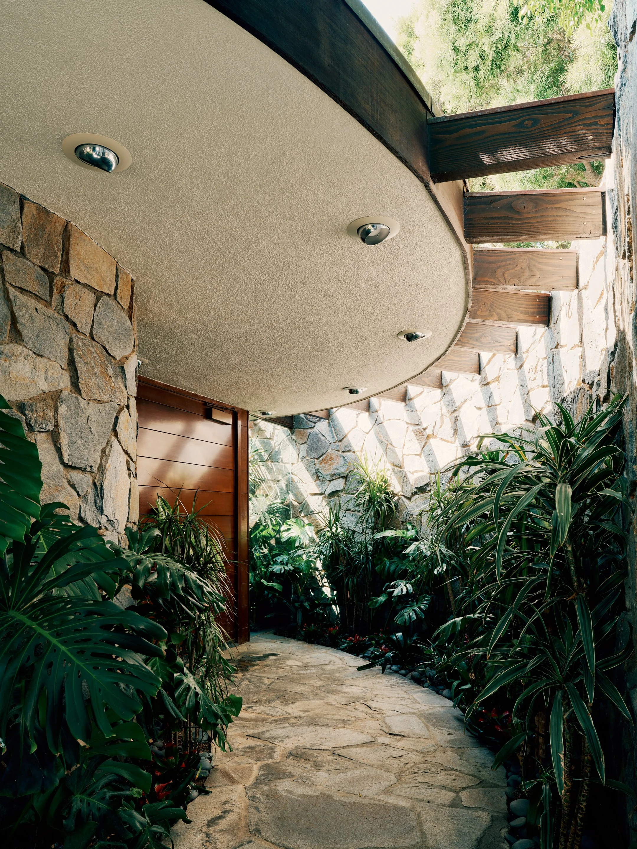 Main Entrance with Custom Wood Pivot Door – Lautner Castle