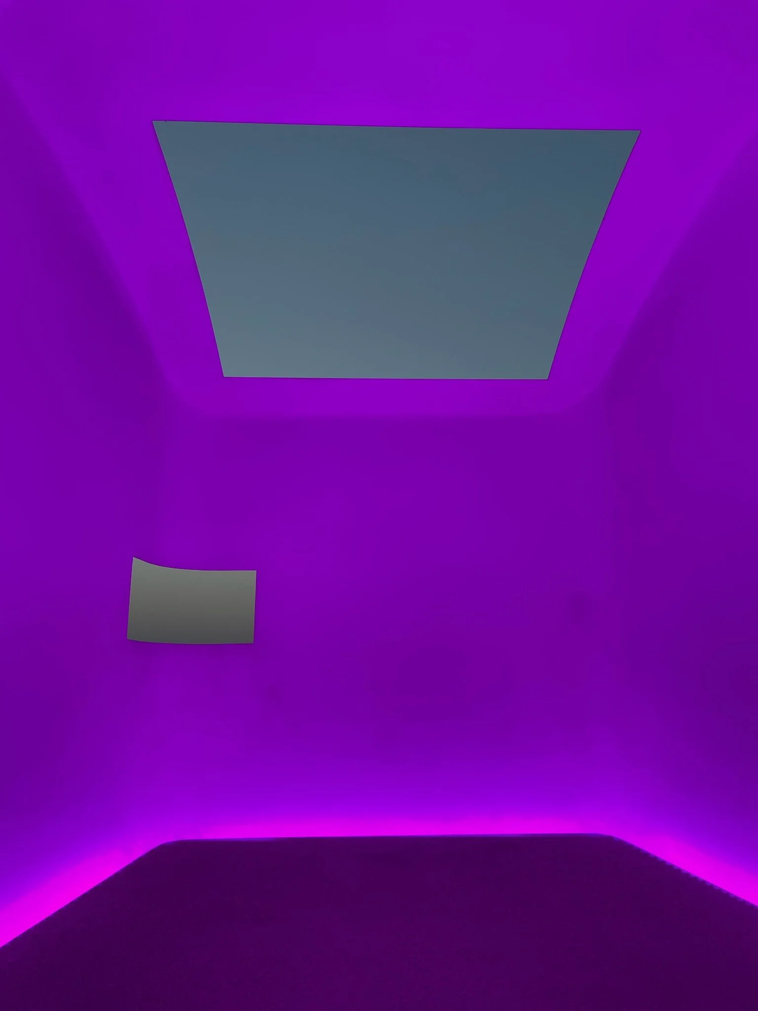 Evening light show in James Turrell Skyspace 'Above Horizon' at Sheats-Goldstein Residence, sky shifting colors through open oculus under intense pink LED illumination – preserved by Conner & Perry Architects, Los Angeles