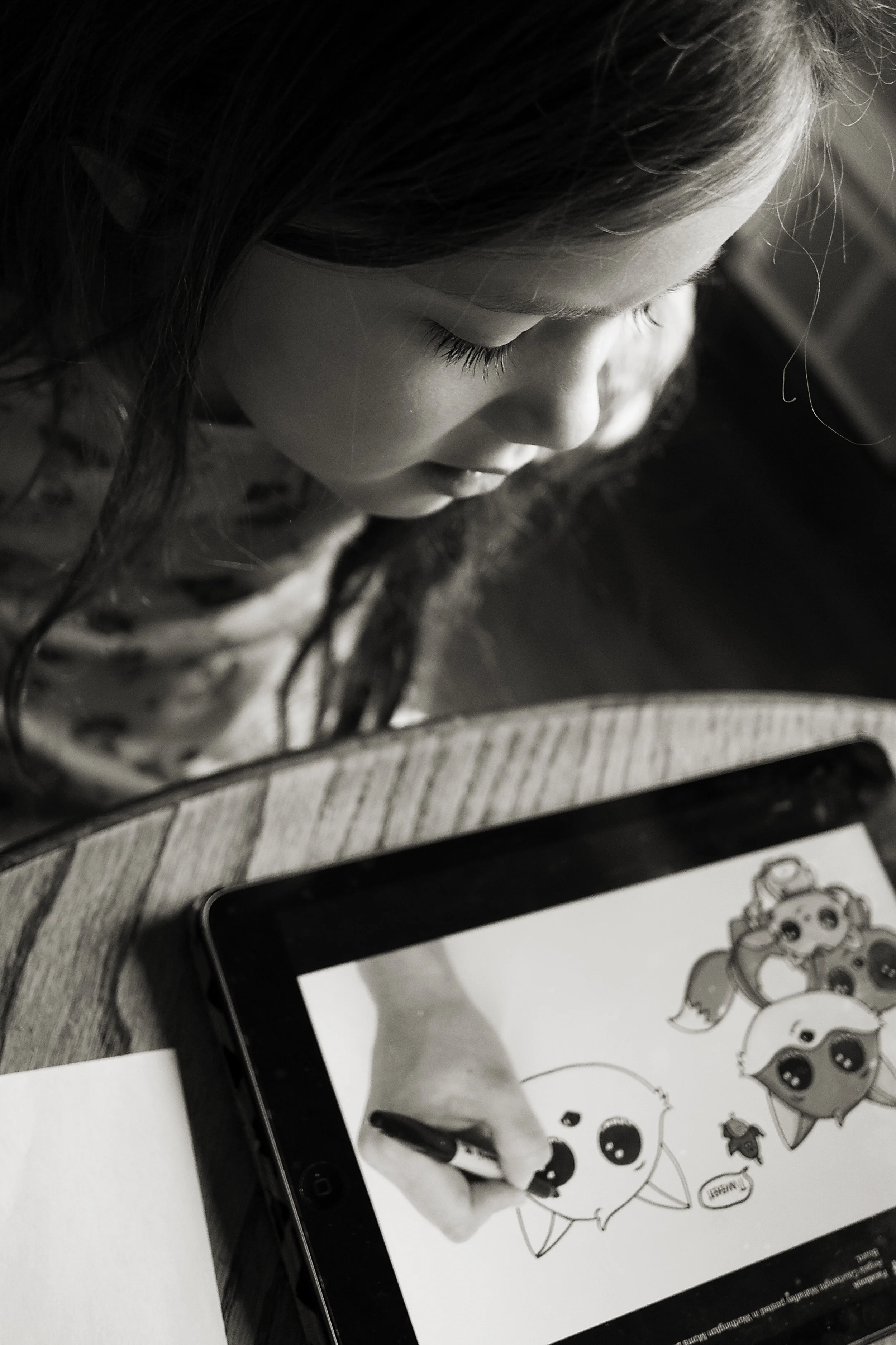 Columbus photographer takes pictures of daughter copying a fox drawing on her ipad in their worthington, ohio home. 