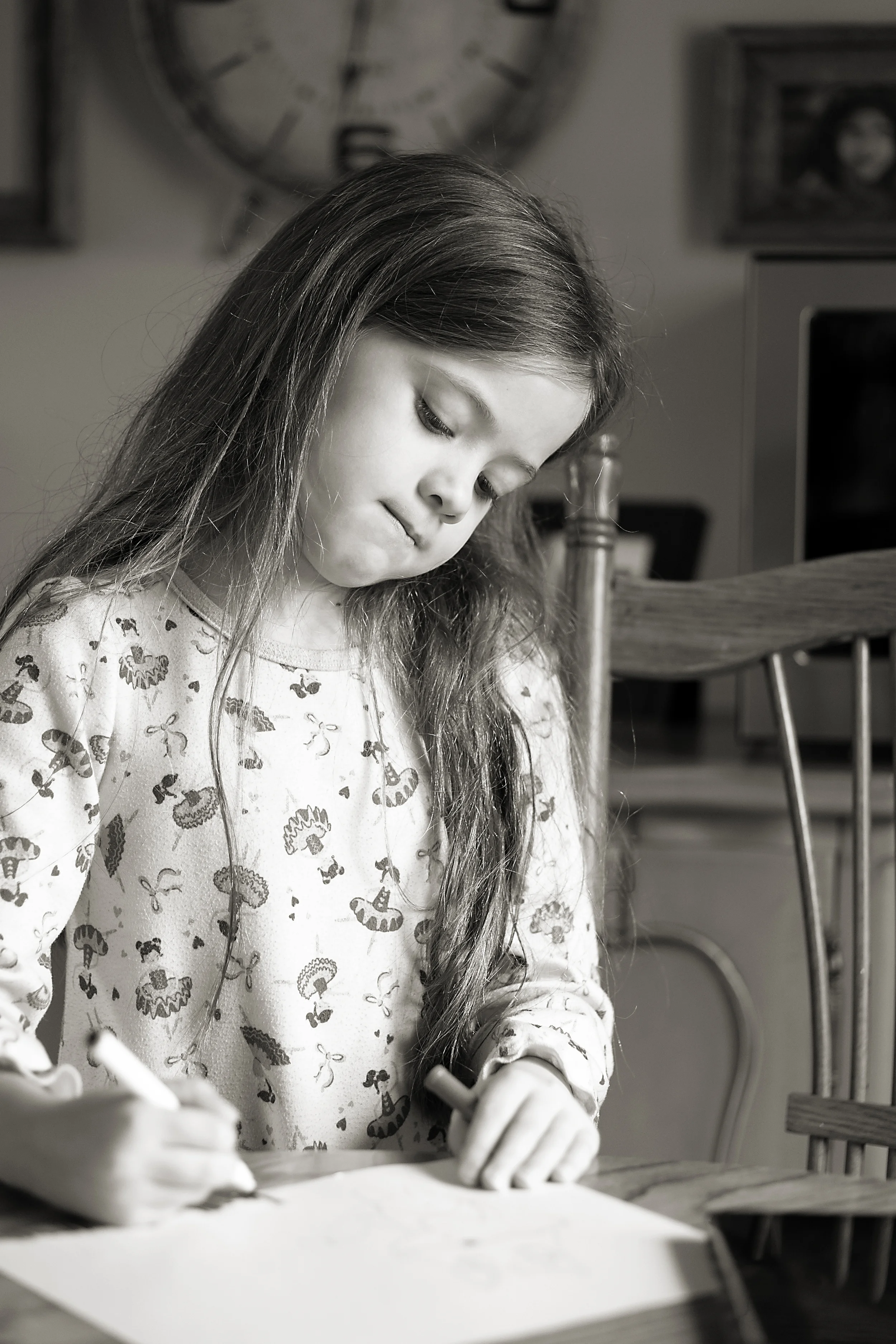 Columbus photographer captures drawing concentration in old worthington home. 