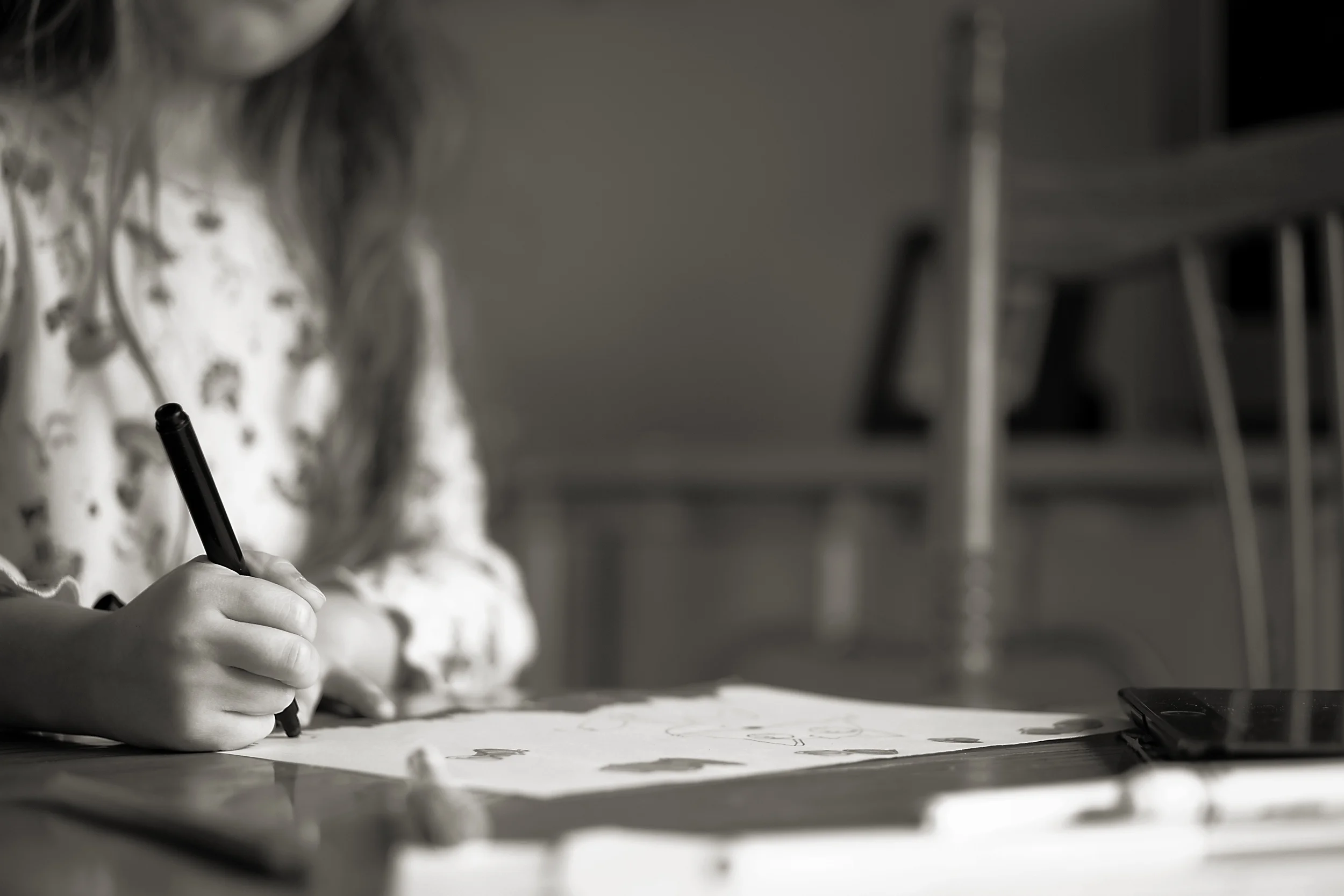 Girl drawing with markers a cartoon fox in vintage home in Columbus, Ohio. 