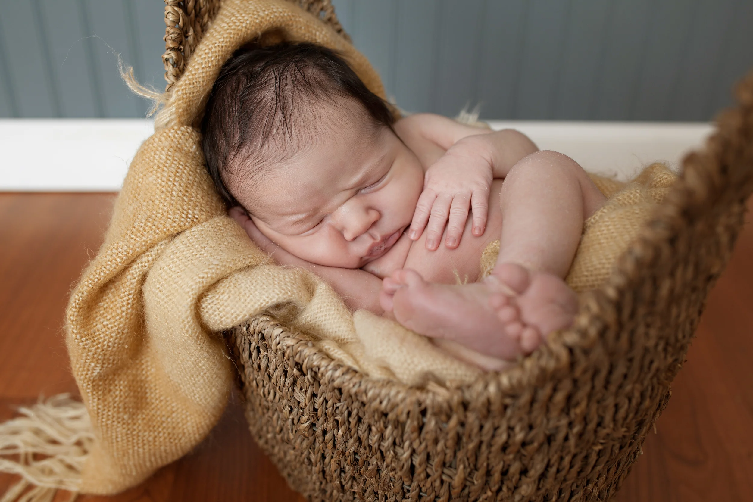 Columbus Newborn photographer, specializing in baby photography. Baby boy posed in basket