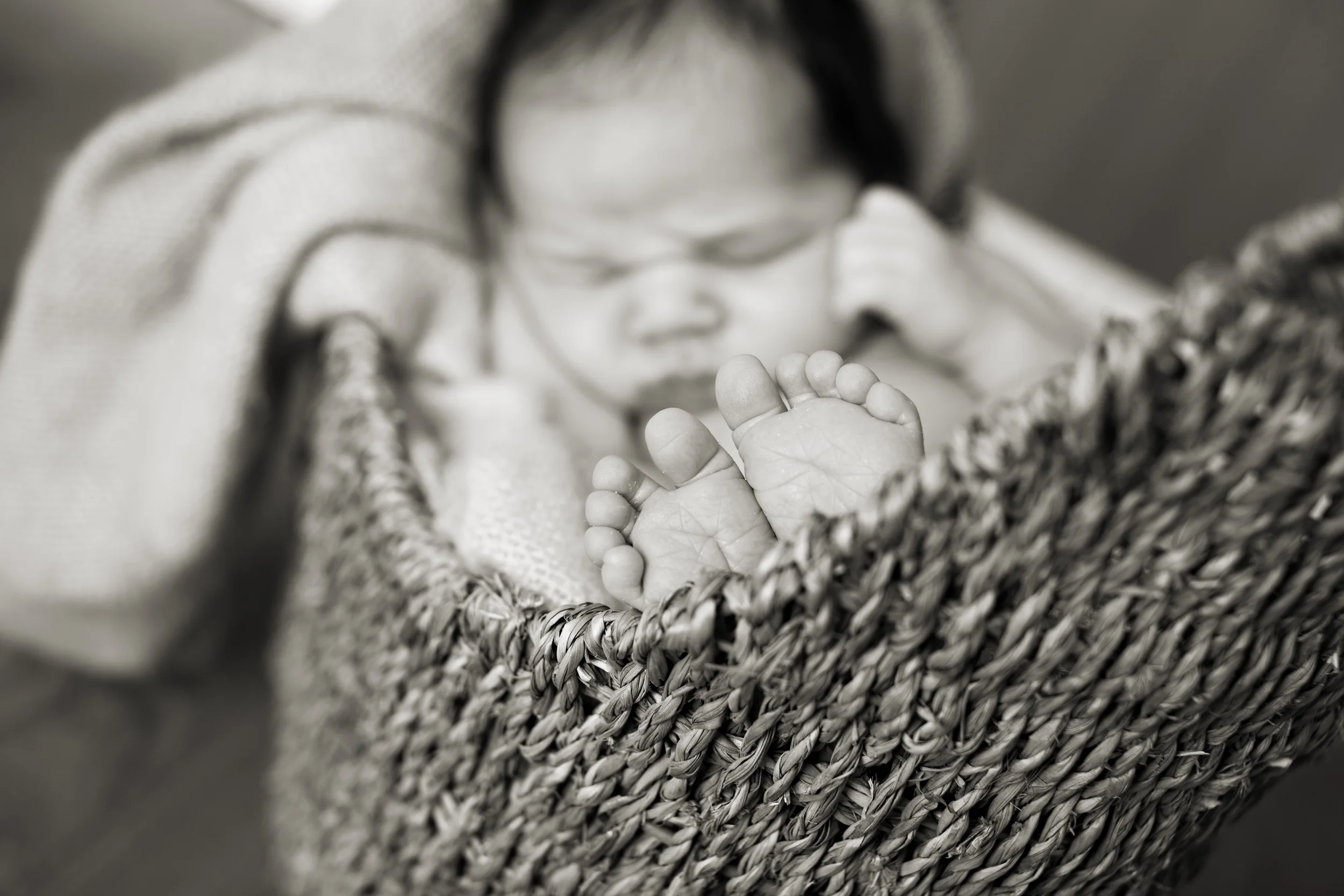 Columbus Newborn photographer, specializing in baby photography. Baby boy posed in basket