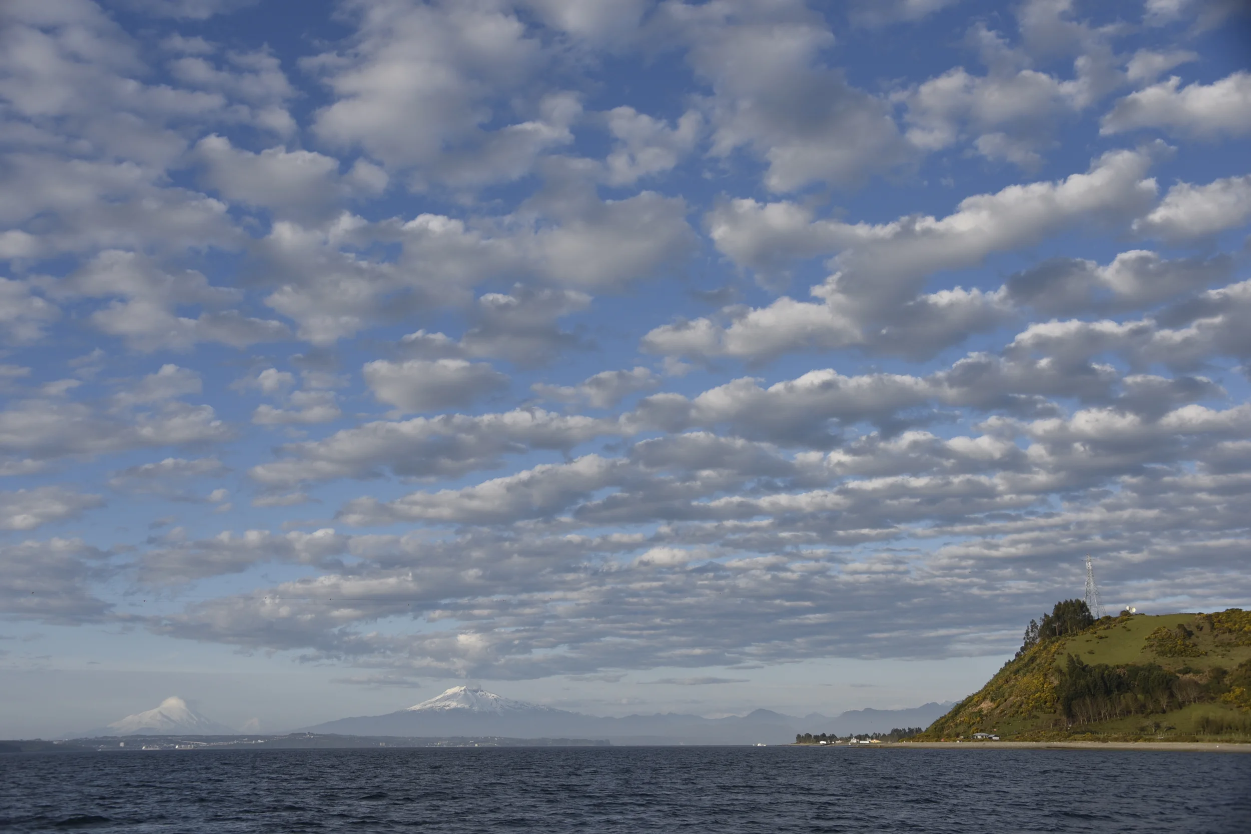 The view doesn't get much better than this... on our way back to Isla Tenglo from Isla Puluqui. Volcanoes Osorno and Calbuco, under some cool cloud formations.