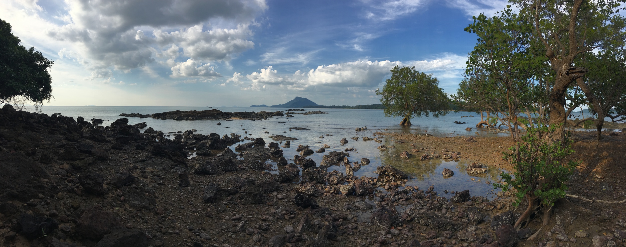 The view from "Lion Island" looking back at Ko Jum with its single hilltop on the horizon. We didn't land the kayaks on this part of Lion Island... there is a somewhat sandier beach just to the right.
