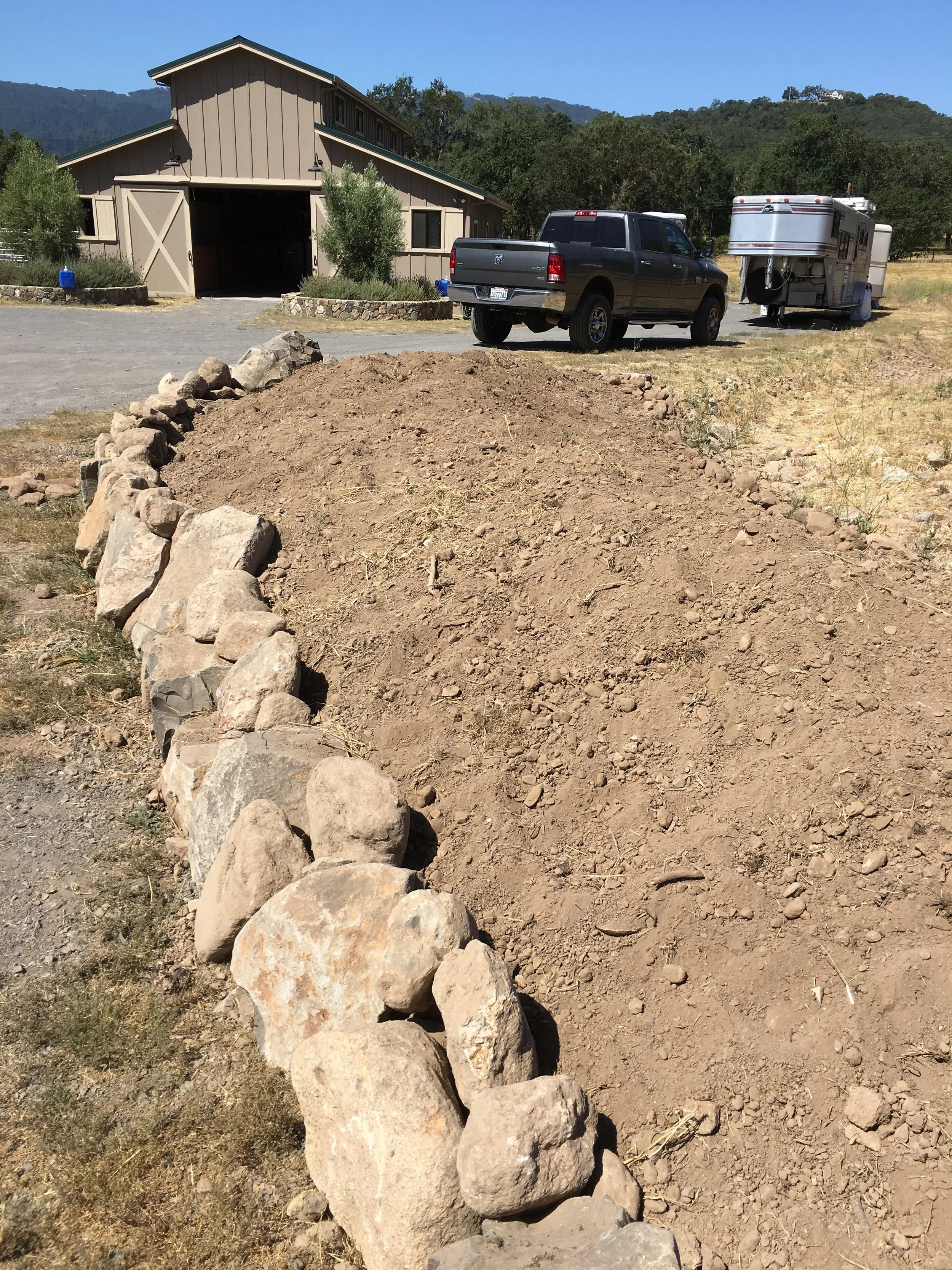 One of the berms, with rock retaining wall.